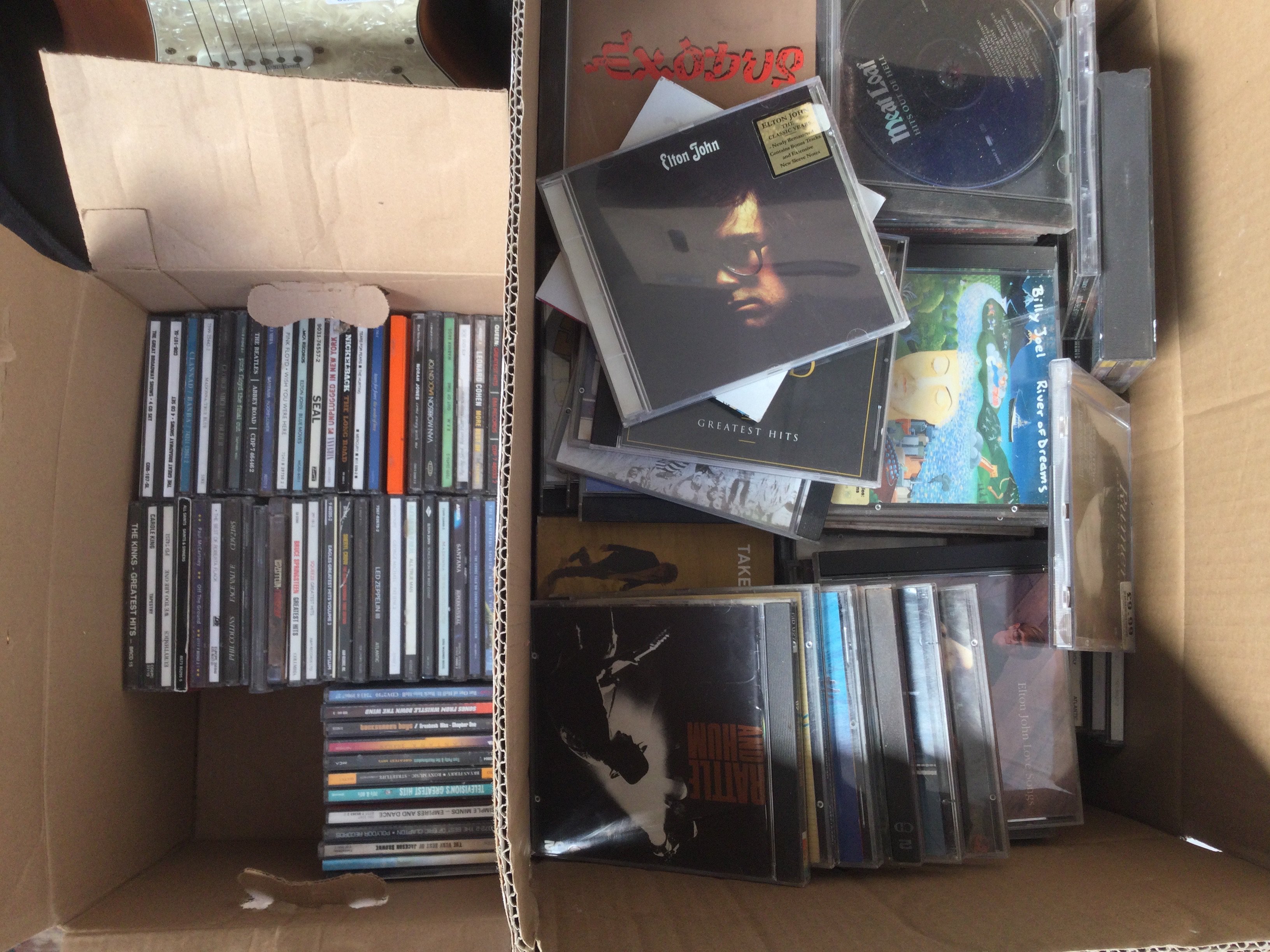 Two boxes of CDs by various artists including Prince, Bob Marley, Led Zeppelin and many more.