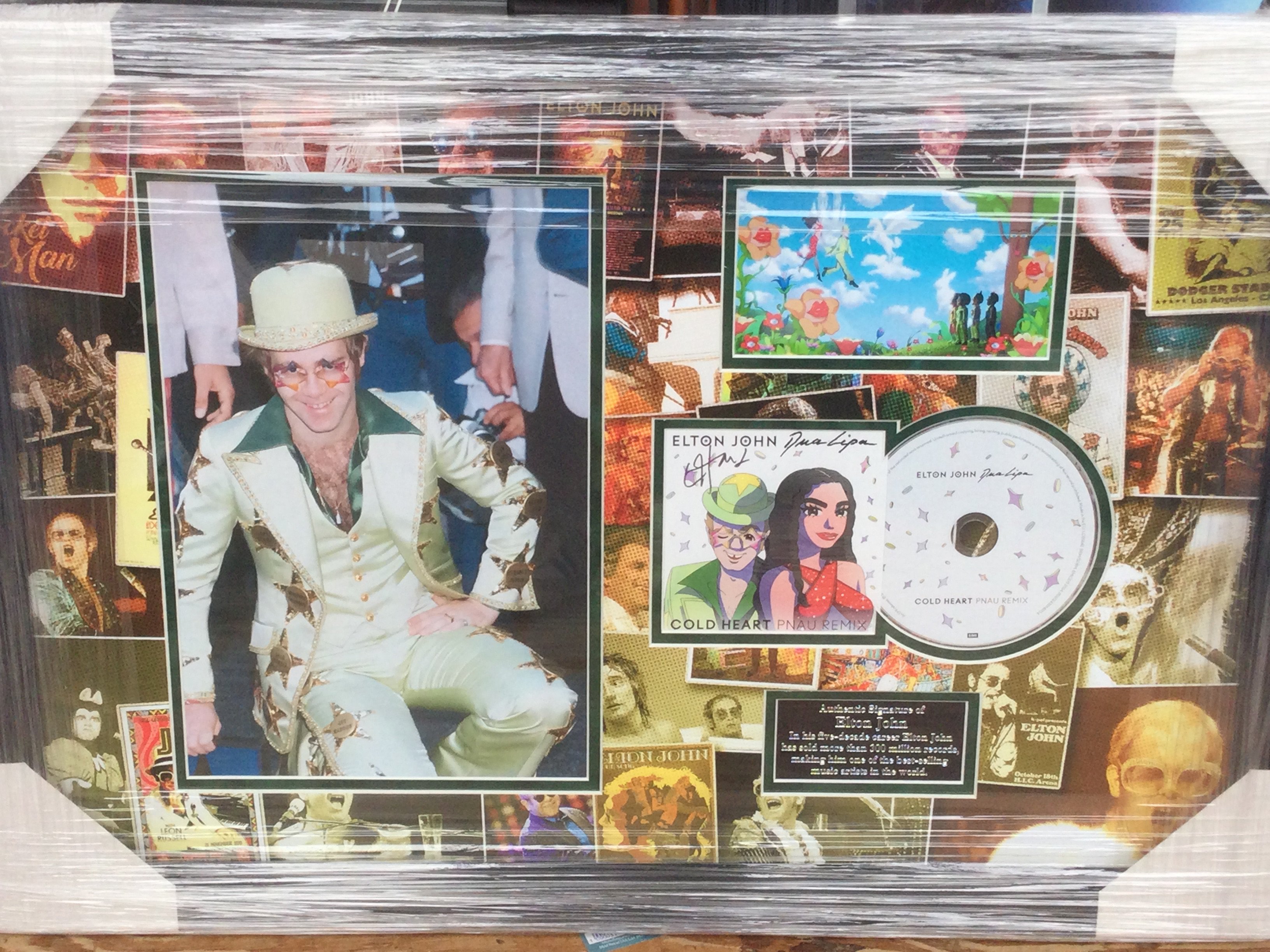 A framed and glazed signed display of Elton John, approx 46cm x 66cm.