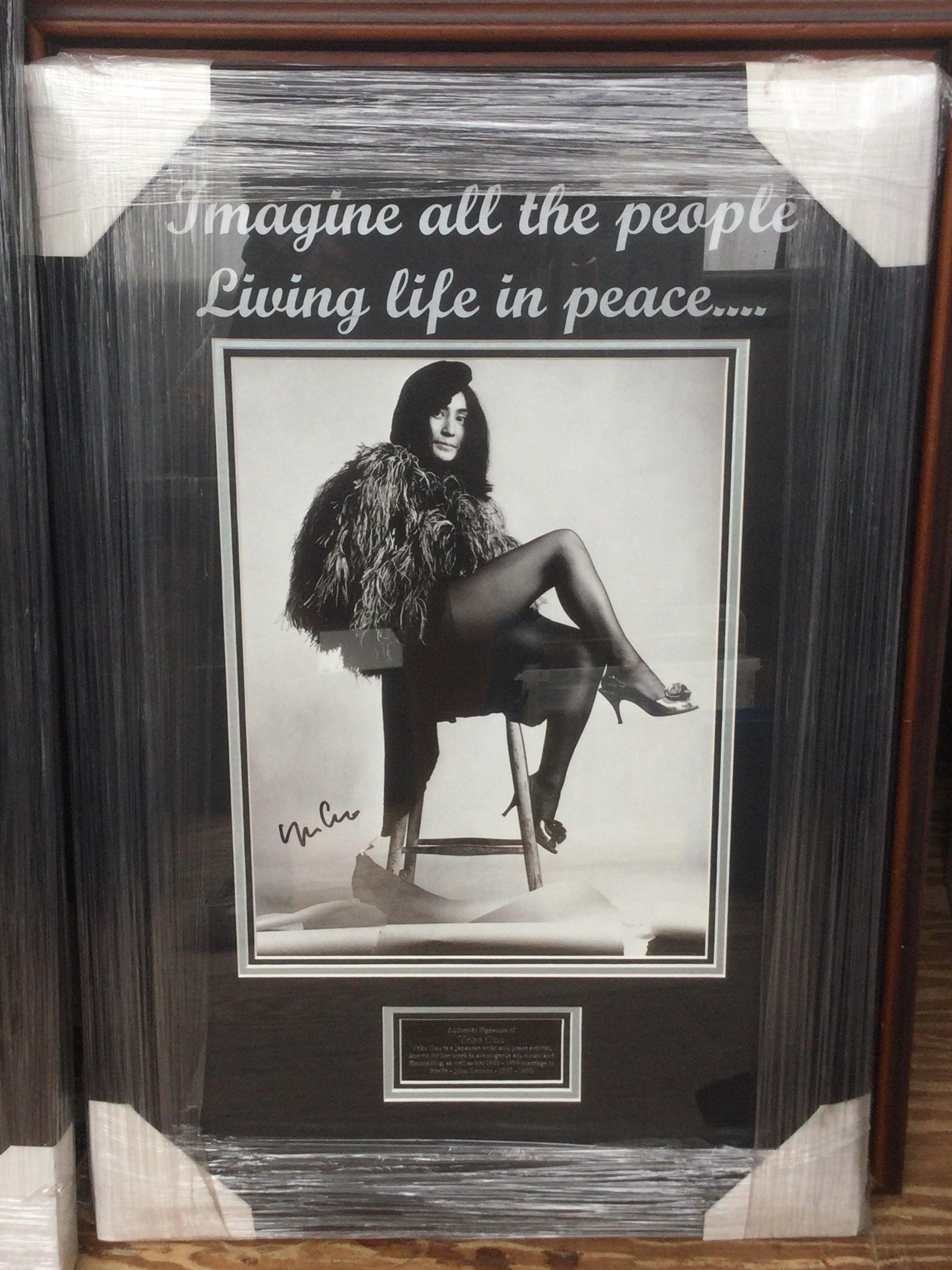 A framed and glazed signed Yoko Ono display with COA, approx 68.5cm x 46.5cm.