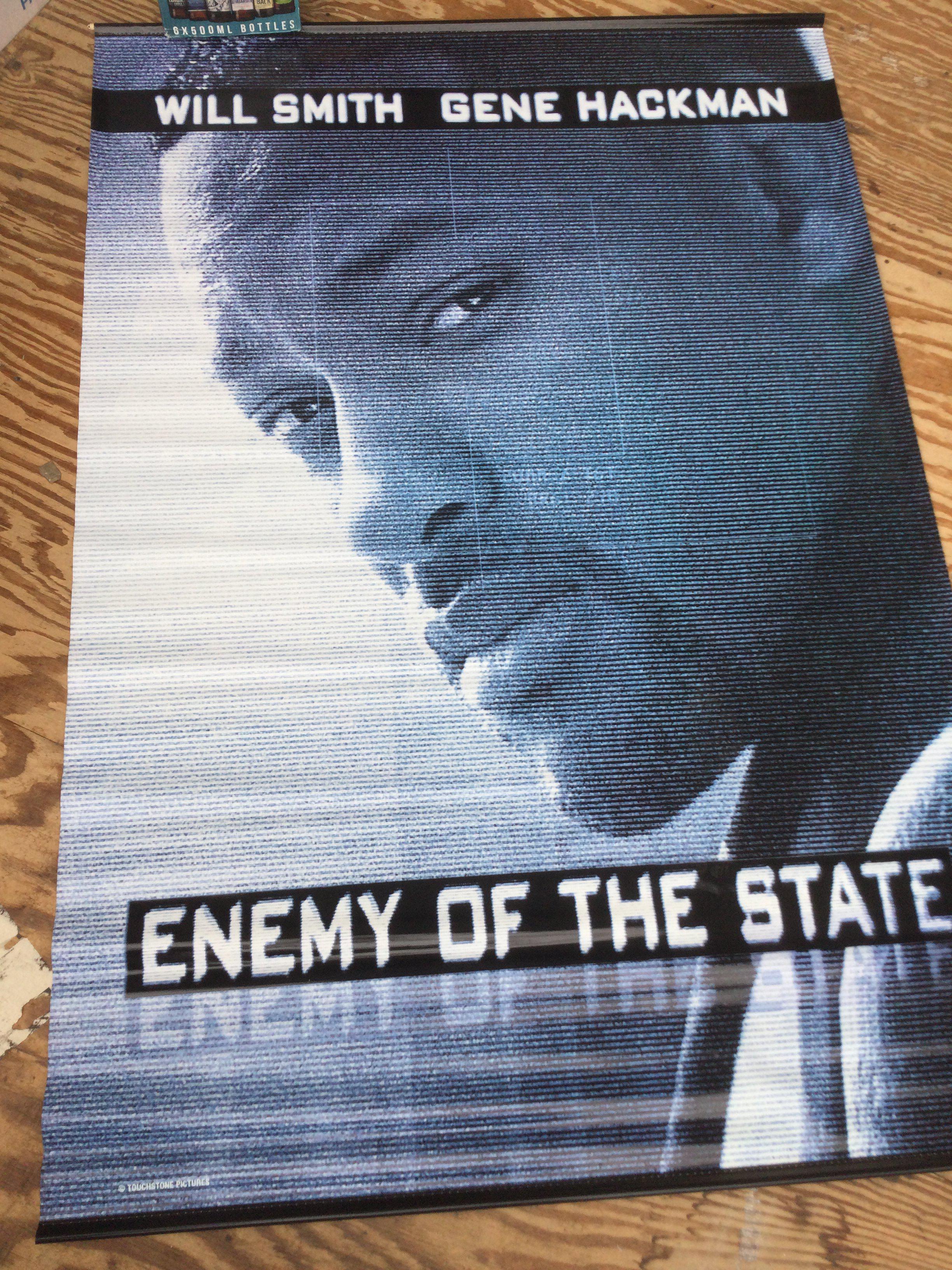 Three large vinyl film poster banners for Enemy Of The State approx 175cm x 119cm, Mission Impossible 2 approx 198cm x 120cm and Indiana Jones and The Kingdom Of The Crystal Skull approx 243cm x 152cm.