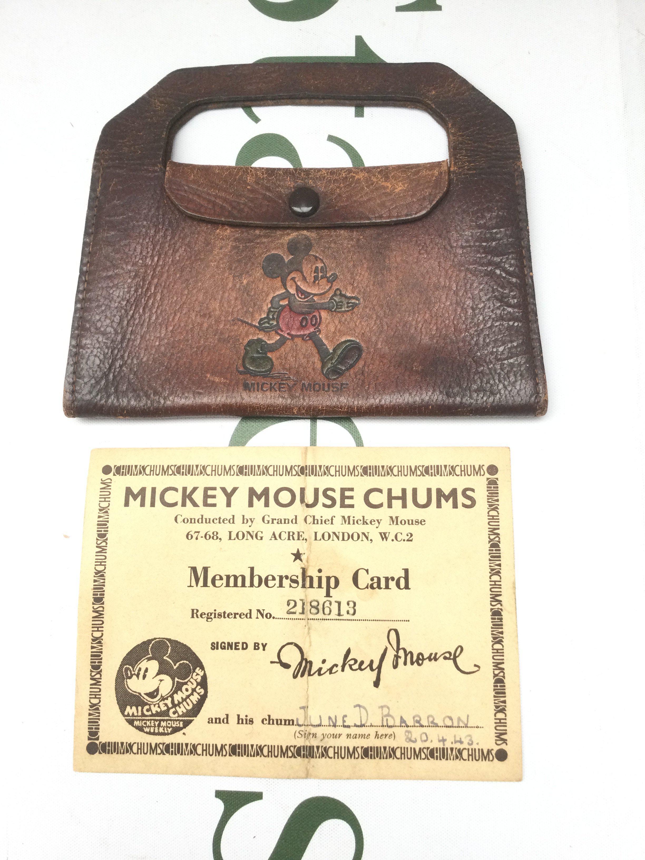 An original Mickey Mouse Chums membership card dated 20/04/1943 and a brown leather Mickey Mouse purse.