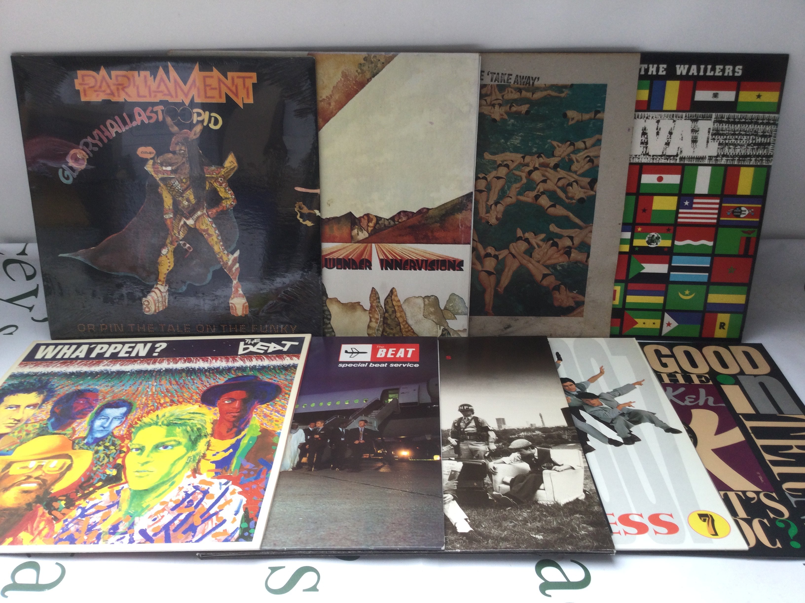 Nine reggae, ska and funk LPs by various artists including Bob Marley & The Wailers, The Beat, Parliament and others.