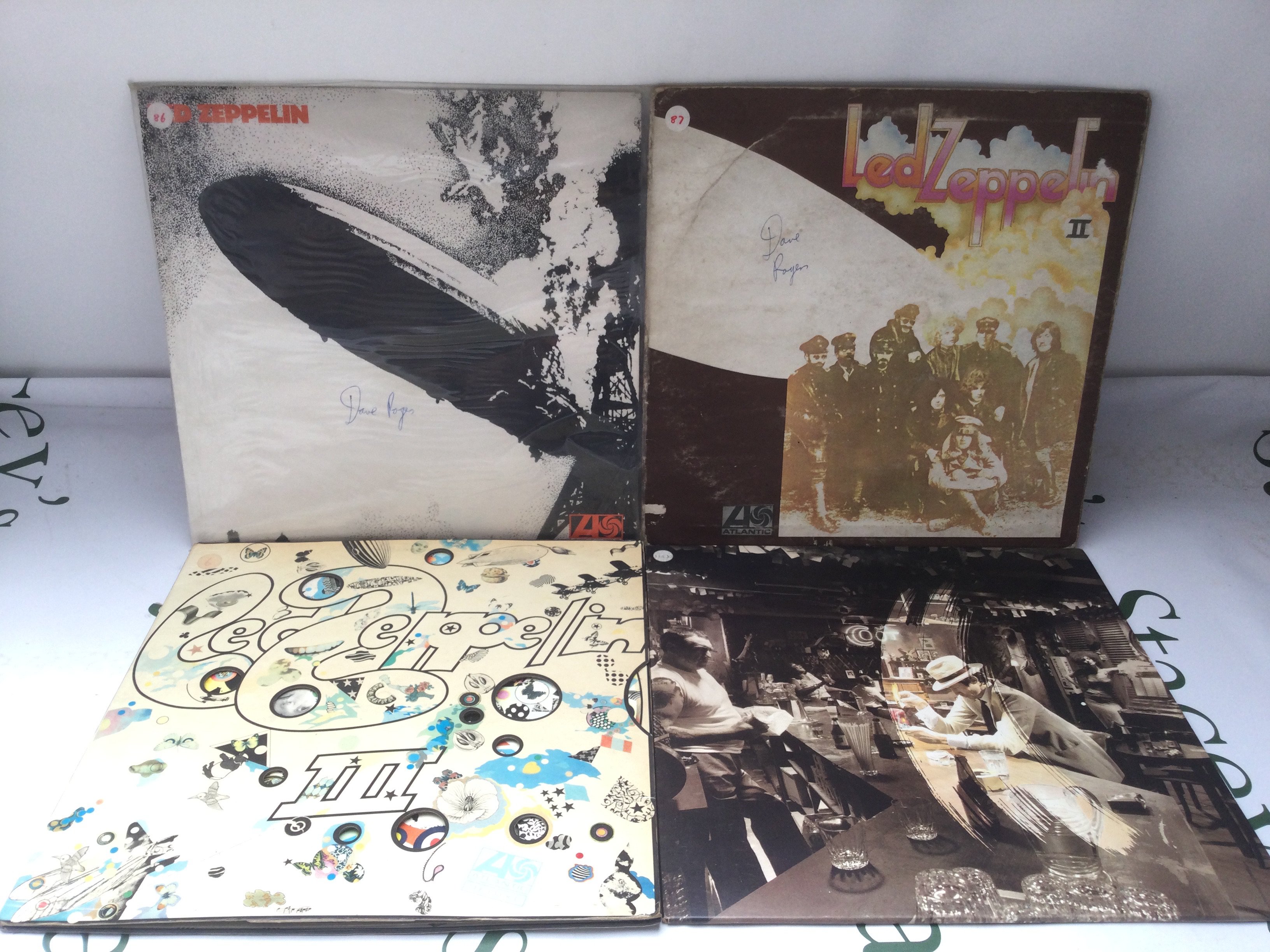 Four Led Zeppelin LPs including red/plum Atlantic labels comprising Led Zeppelin 1,2 and 3 plus In Through The Out Door. Led Zep 3 has one feelable scratch. Sleeve issues.