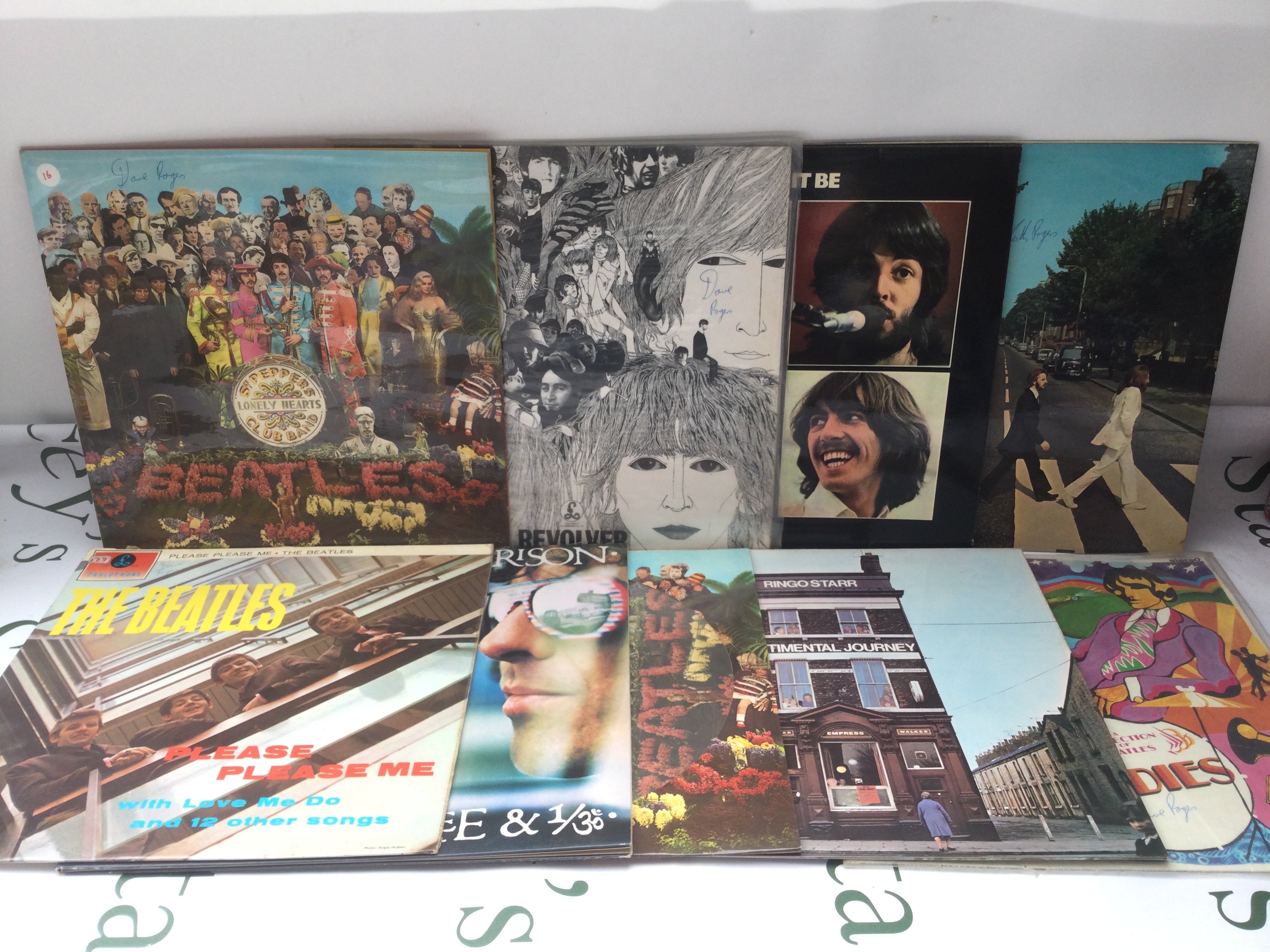 Nine Beatles and solo LPs comprising Revolver, Abbey Road, a Sgt Pepper picture disc and others.