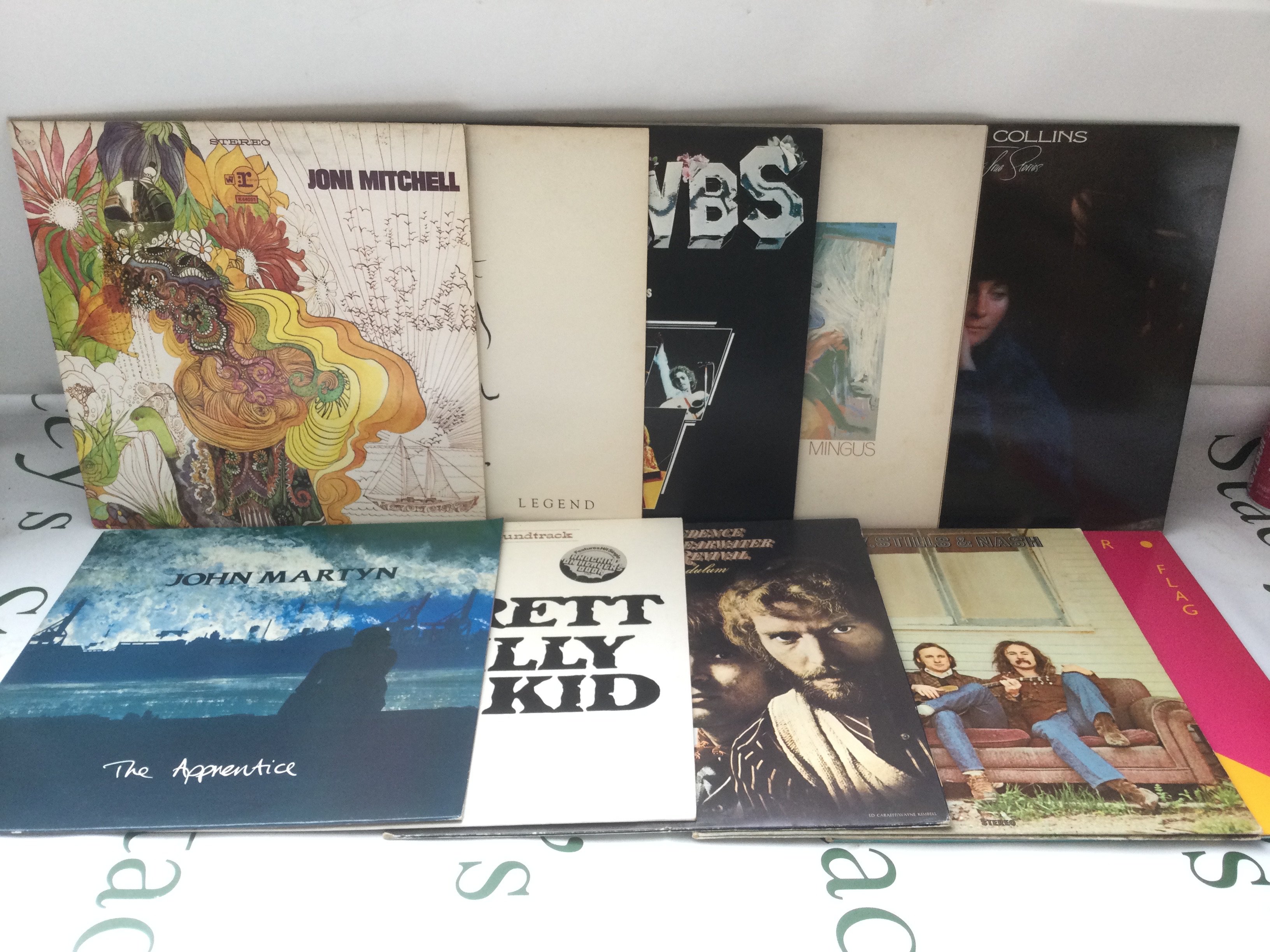 Two bags containing 20 folk rock LPs by various artists including John Martyn, Joni Mitchell, Judy Collins and others.