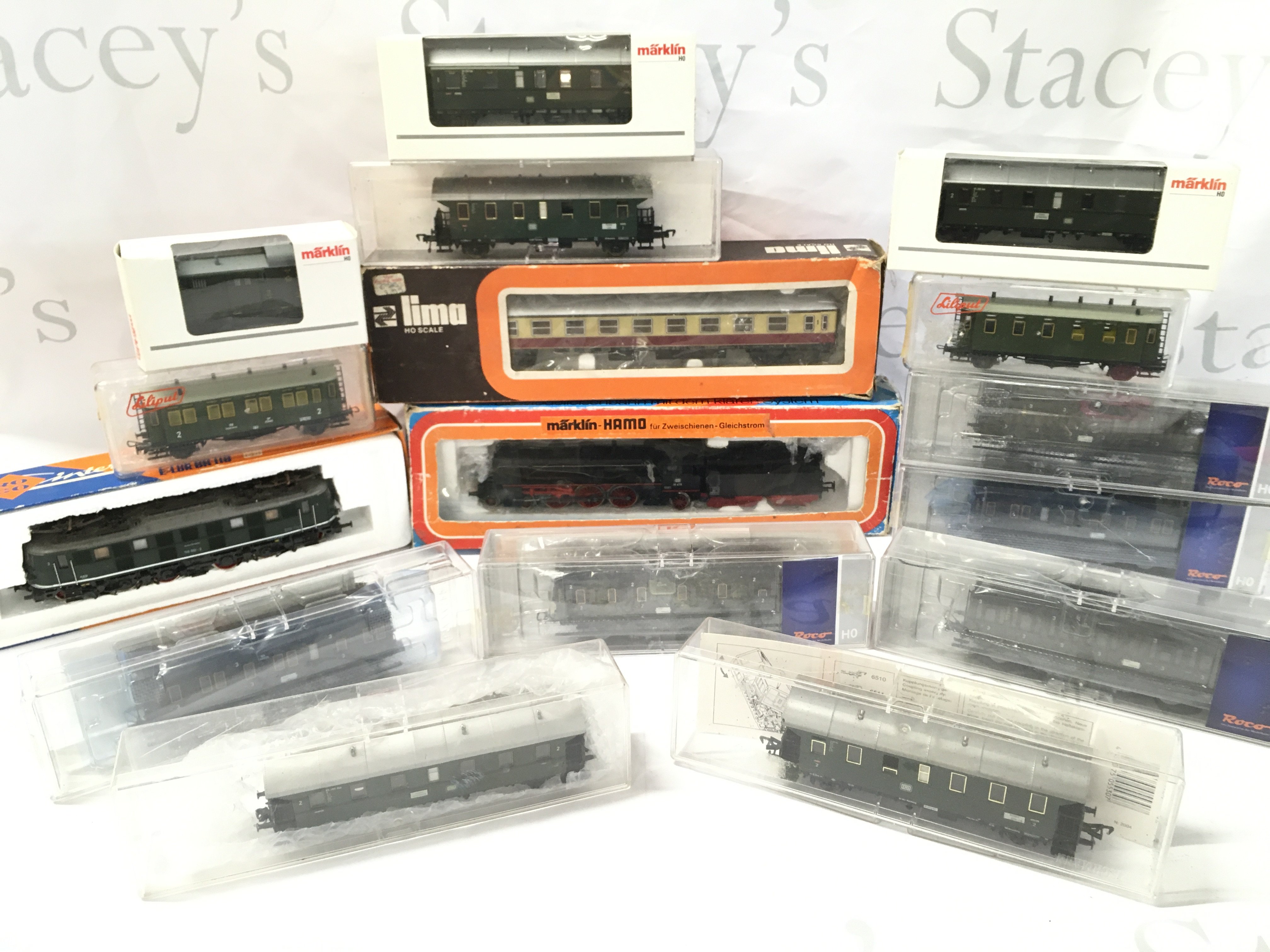 A Collection Of 2 X H0 Locomotives And Coaches. Including Roco.Lima And Marklin.