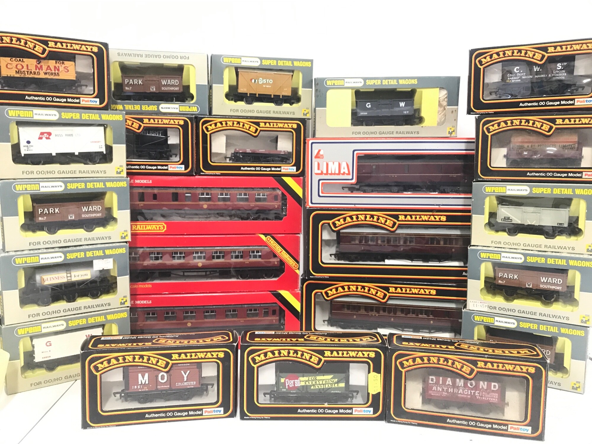 A Collection Of 00 Gauge Wagons And Coaches. By Hornby. Wrenn And Mainline.