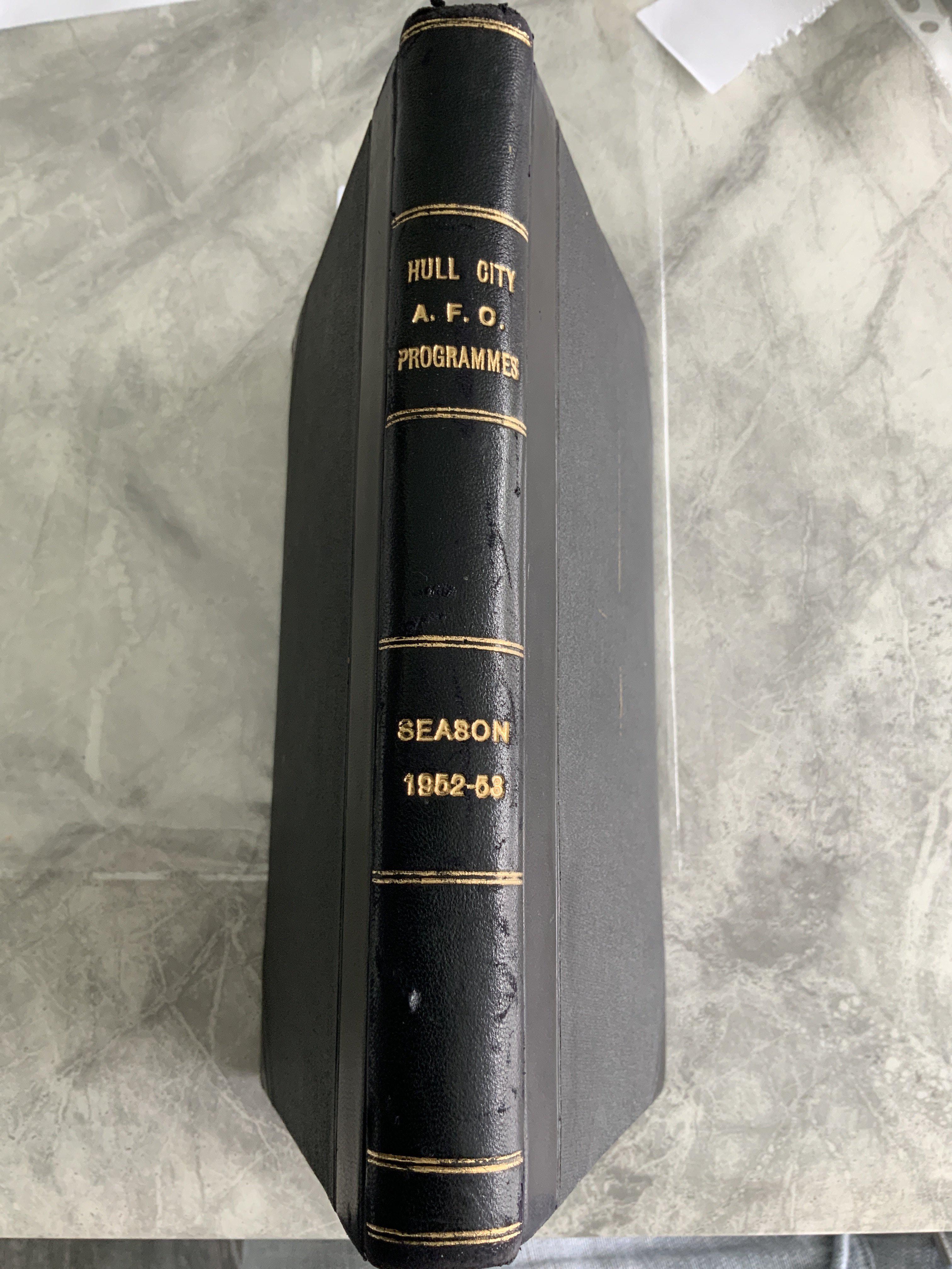 52/53 Hull City Bound Volume Of Football Programmes: Includes England v Holland Amateurs, Dundee, Hibernian, East Fife, Stockholm friendlies and East Riding Cup. League matches complete and in stunning unwritten condition with covers. Blue boards state Hull City AFC Programmes Season 1952-53 to spine.