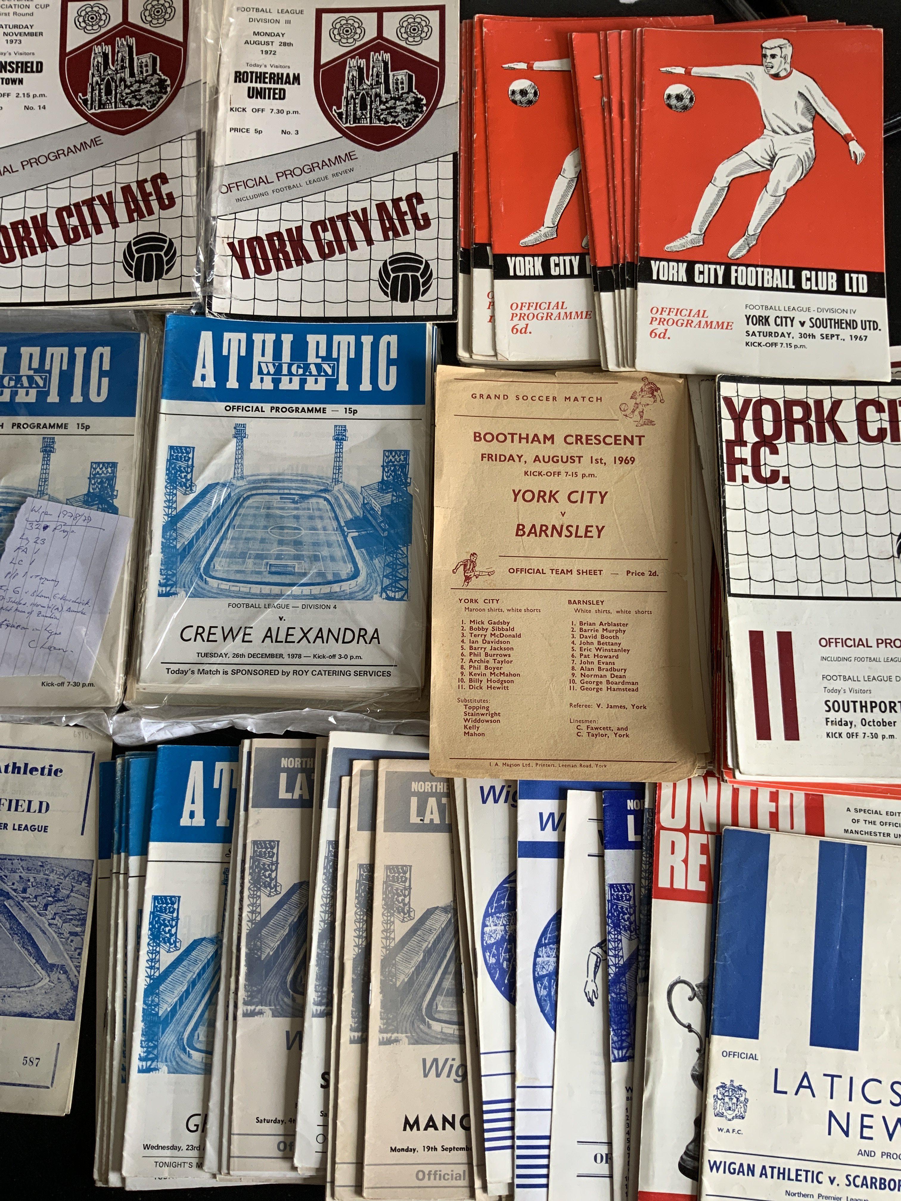 York City + Wigan Athletic Home Football Programmes: York has 65 from the 60s and 50 from the 70s. Wigan has around 100 including a set of 32 from 78/79 plus many spares additionally and some earlier. Instructions to sell. Very good. (est 220)