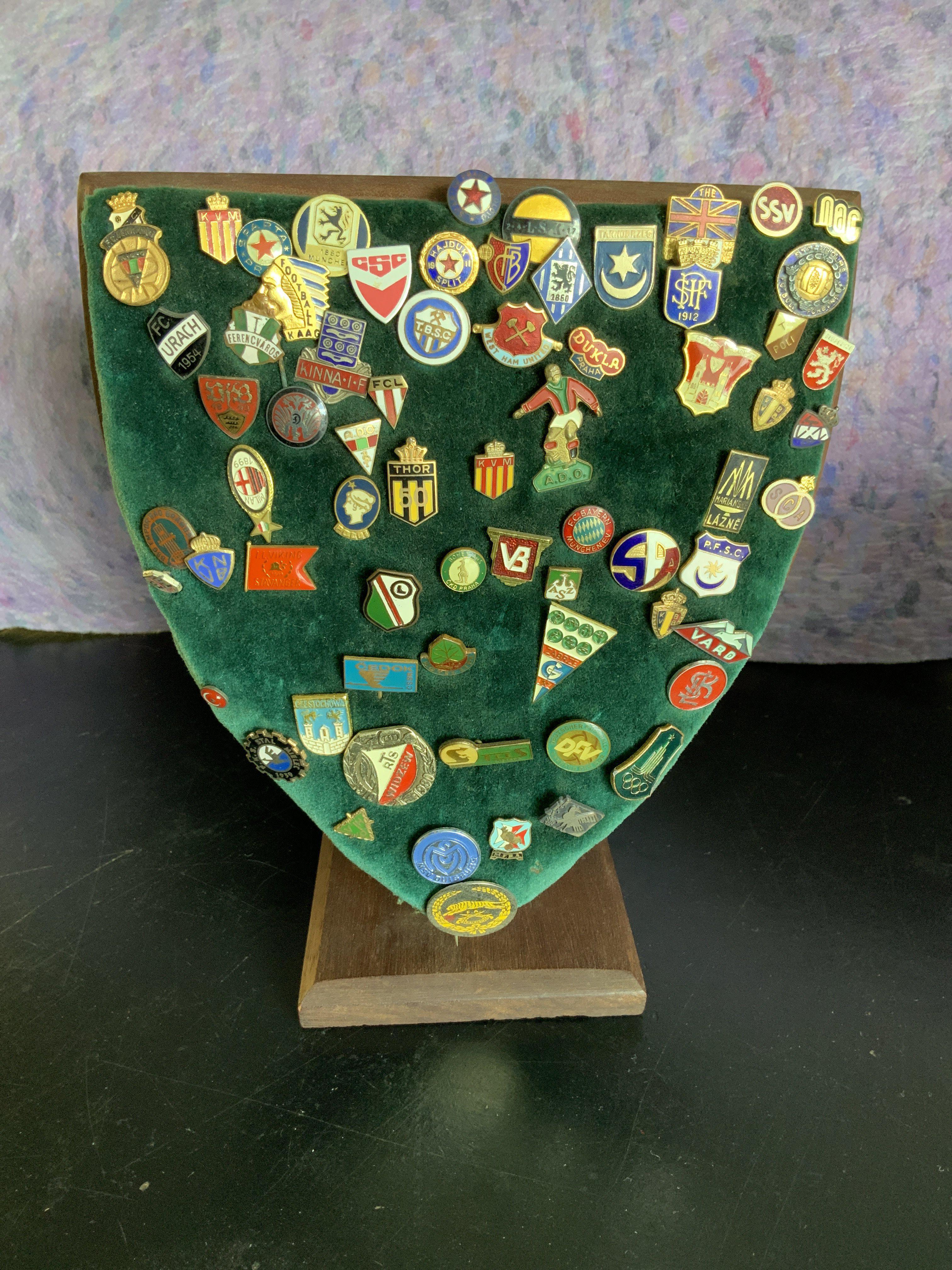 Ron Boyce West Ham Football Badge Collection: Collected during his playing and coaching career and features rare and unusual badges from around the world. Many relate to iconic tournaments including the American Soccer League and European Cup Winners Cup. Clubs noted include TSV Munich, La Gantoise, Eintracht Frankfurt, Borussia Dortmund, Dukla Prague and many more. Still on 3 baise plaques that were proudly on display at his house. (Est 150+)