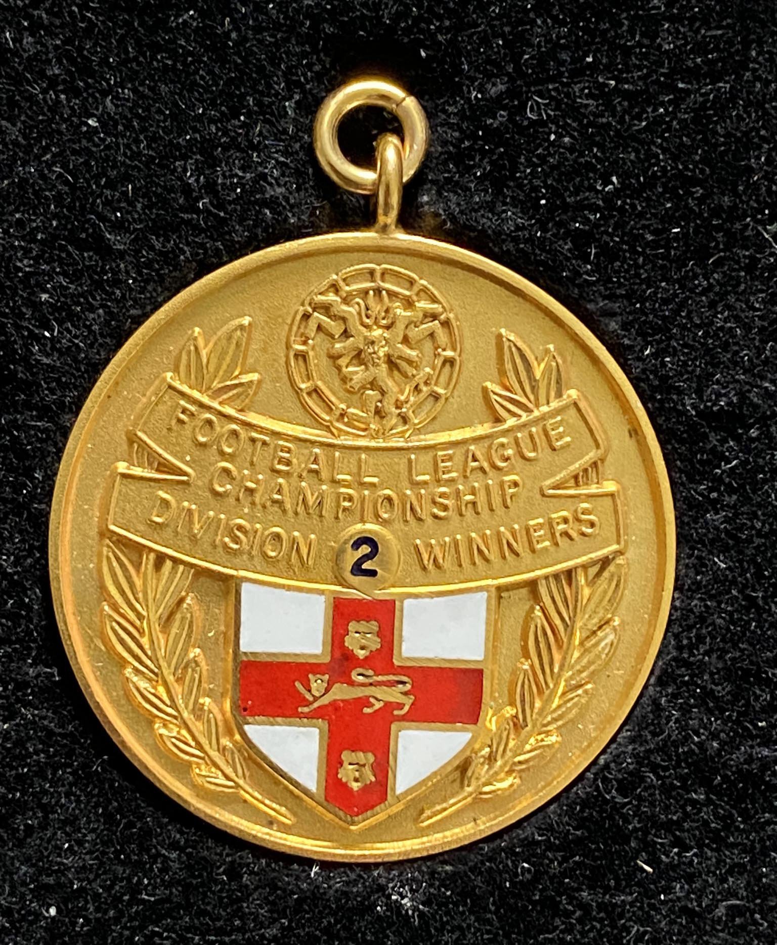 John Lyalls West Ham 80/81 League Winners Gold Medal: 9ct Division Two Championship gold medal in original Vaughtons Ltd Box. Stunning piece of West Ham history with COA from the family.