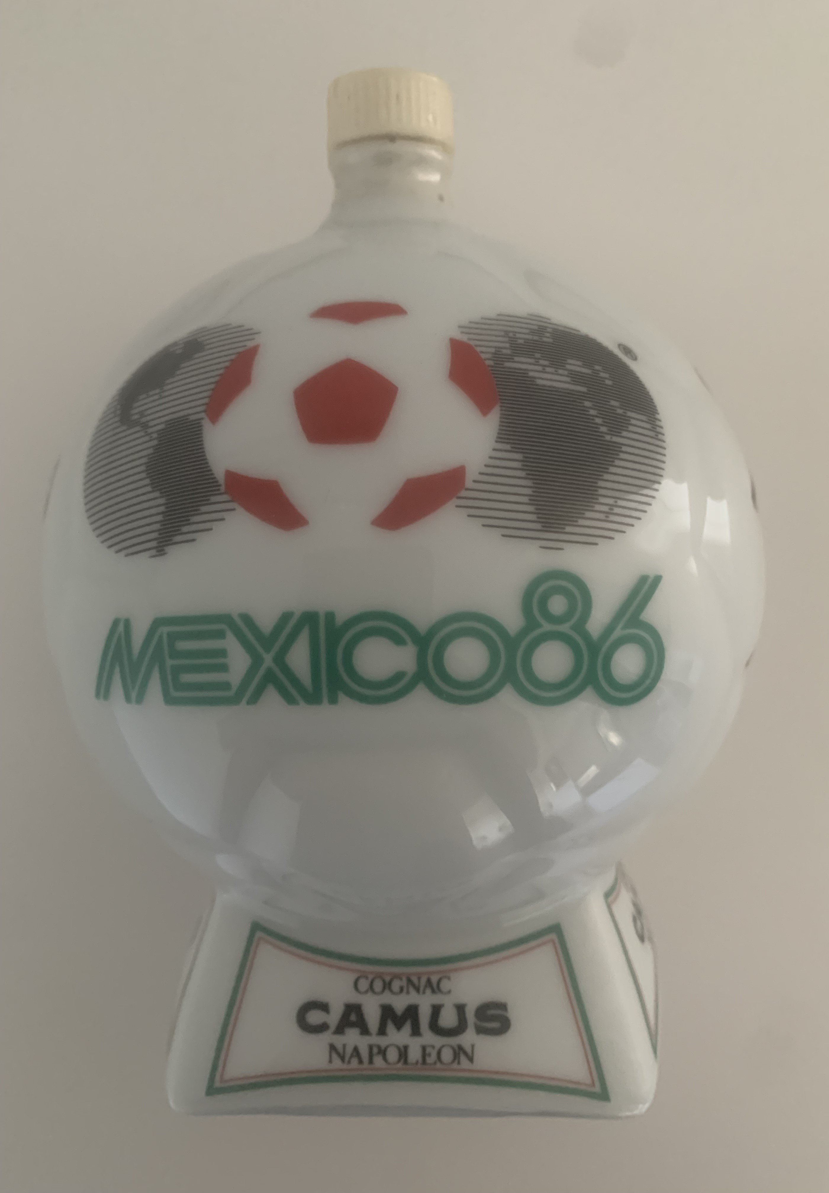 1986 Mexico World Cup Brandy Football Gift: Cognac Camus Napoleon Brandy believed to be brought back and gifted by Frank McAvennie. 700ml contents untouched.
