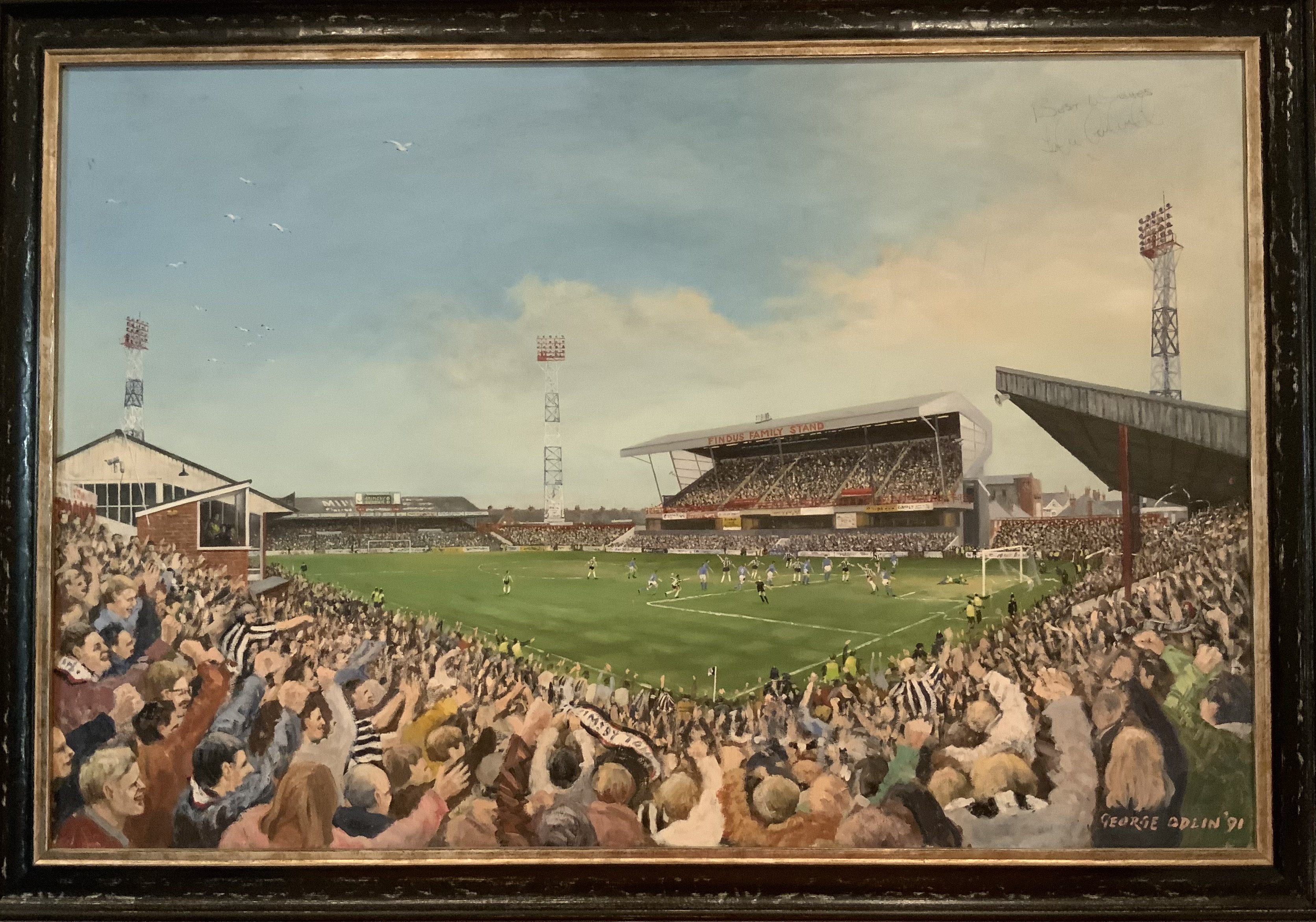 George Odin Grimsby Town Ground Original Painting: Framed oil painting of Blundell Park in 1991 which depicts Grimsby scoring v Exeter. Signed by Grimsby player John Cockerill. Measures 90 x 60cm and is not for posting.