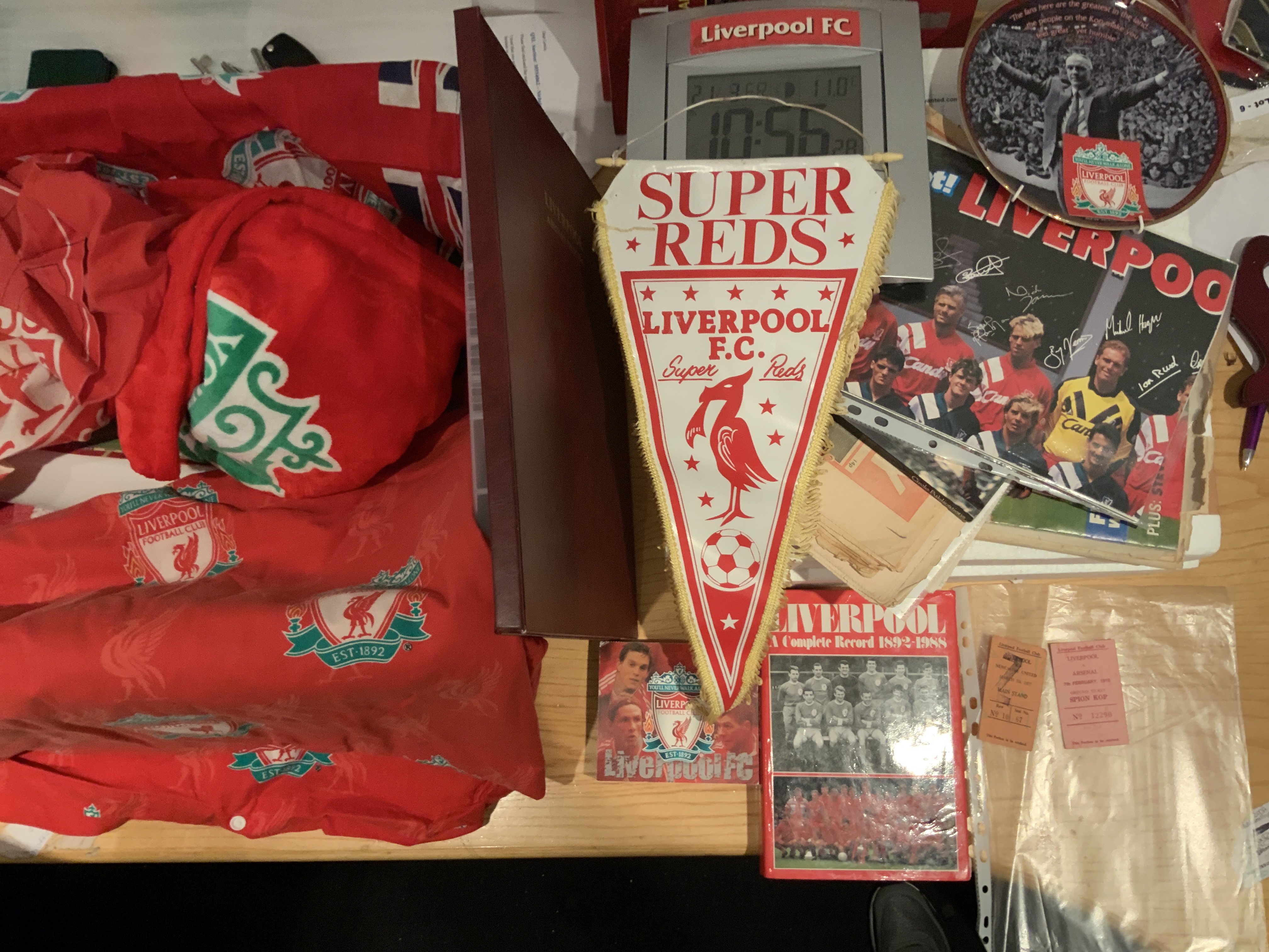 Liverpool Football Memorabilia: Large Danbury Mint plate from 2005 named The Road To The Final, Annuals, Breedon Complete Record book, Bed spread, Bar towels, Shankly plate, Scarves, Pennants, Programmes a few 70s tickets and more. Instructions to sell. (2 boxes)