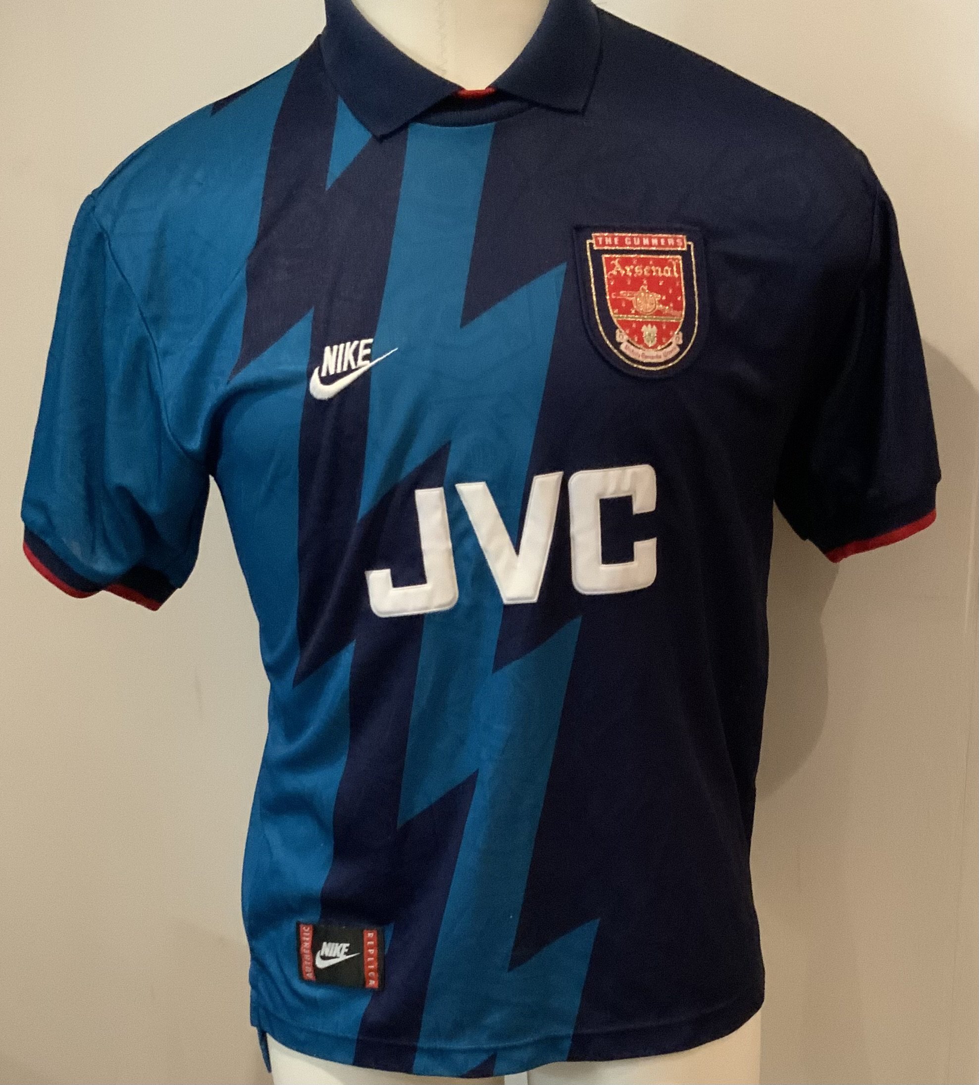 Arsenal 95 - 96 Away Football Shirt: Short sleeve blue replica JVC in good condition. Size medium.