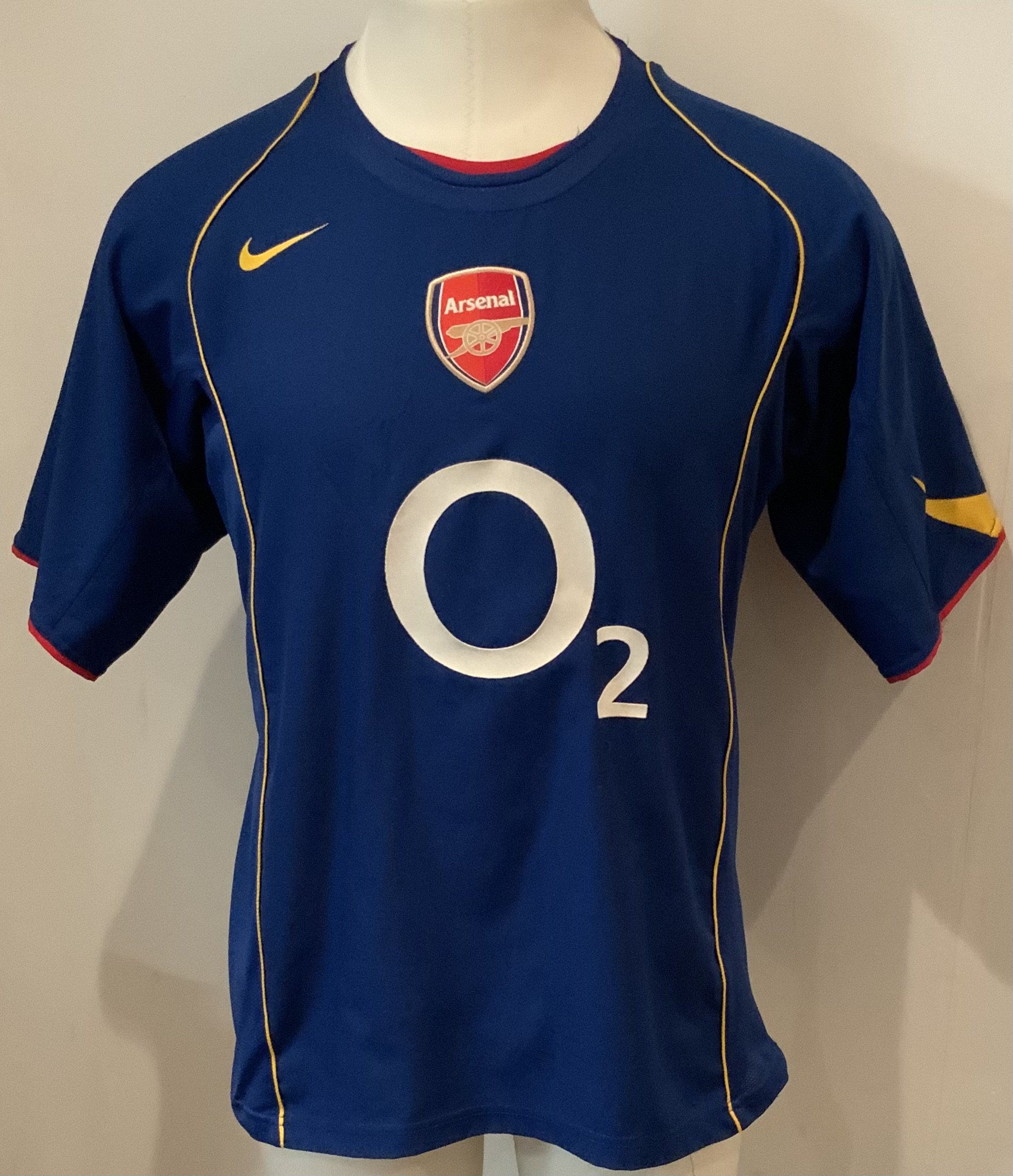 Arsenal 04 - 06 Away Football Shirt: Short sleeve blue replica O2 in good condition. Size large.