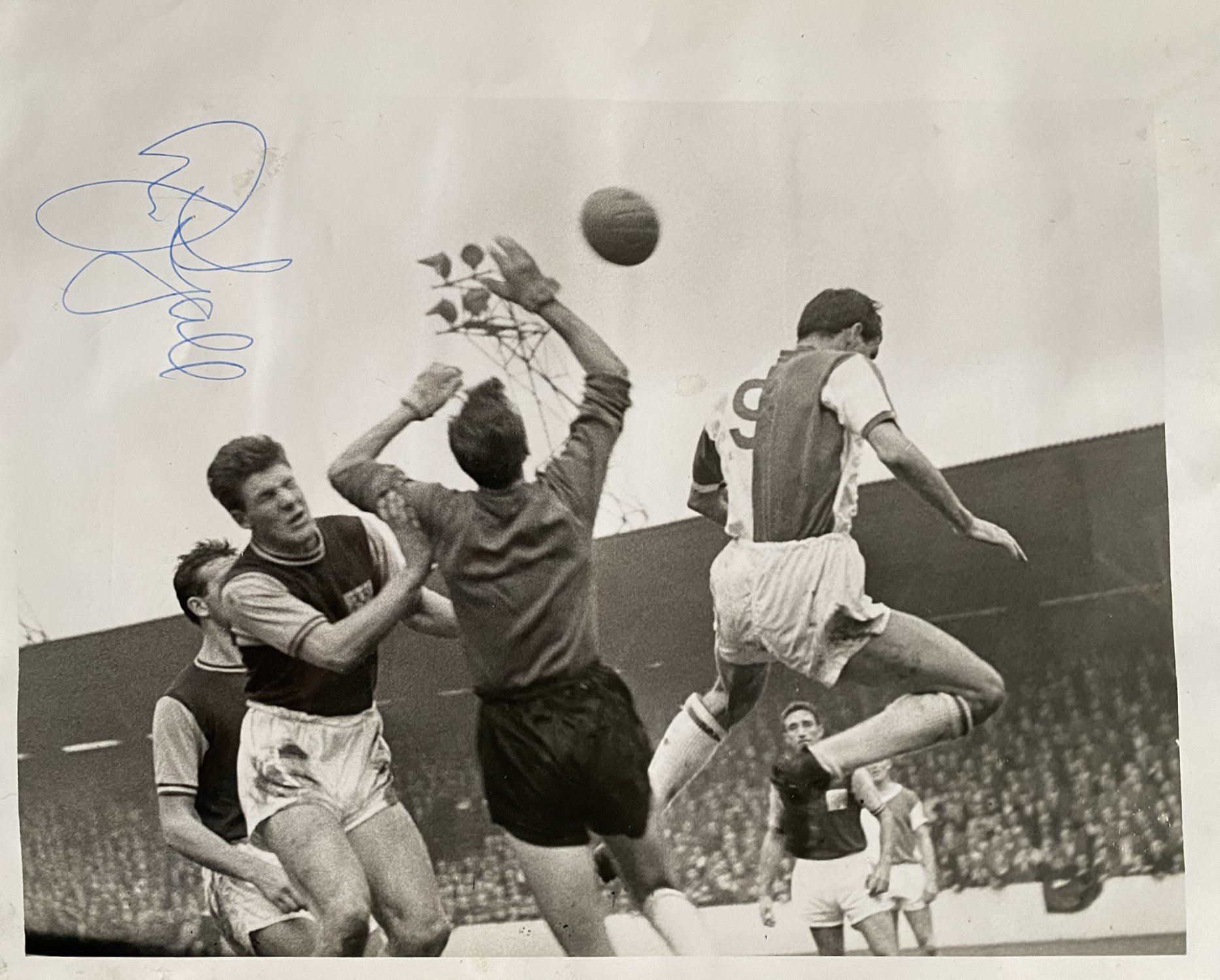 John Lyalls Early West Ham Family Scrapbook: Compiled by his wife Yvonne and includes signed photos of John. Programmes include 16 programmes from 60/61 and an away complimentary ticket at double winners Tottenham all stuck down to scrapbook.