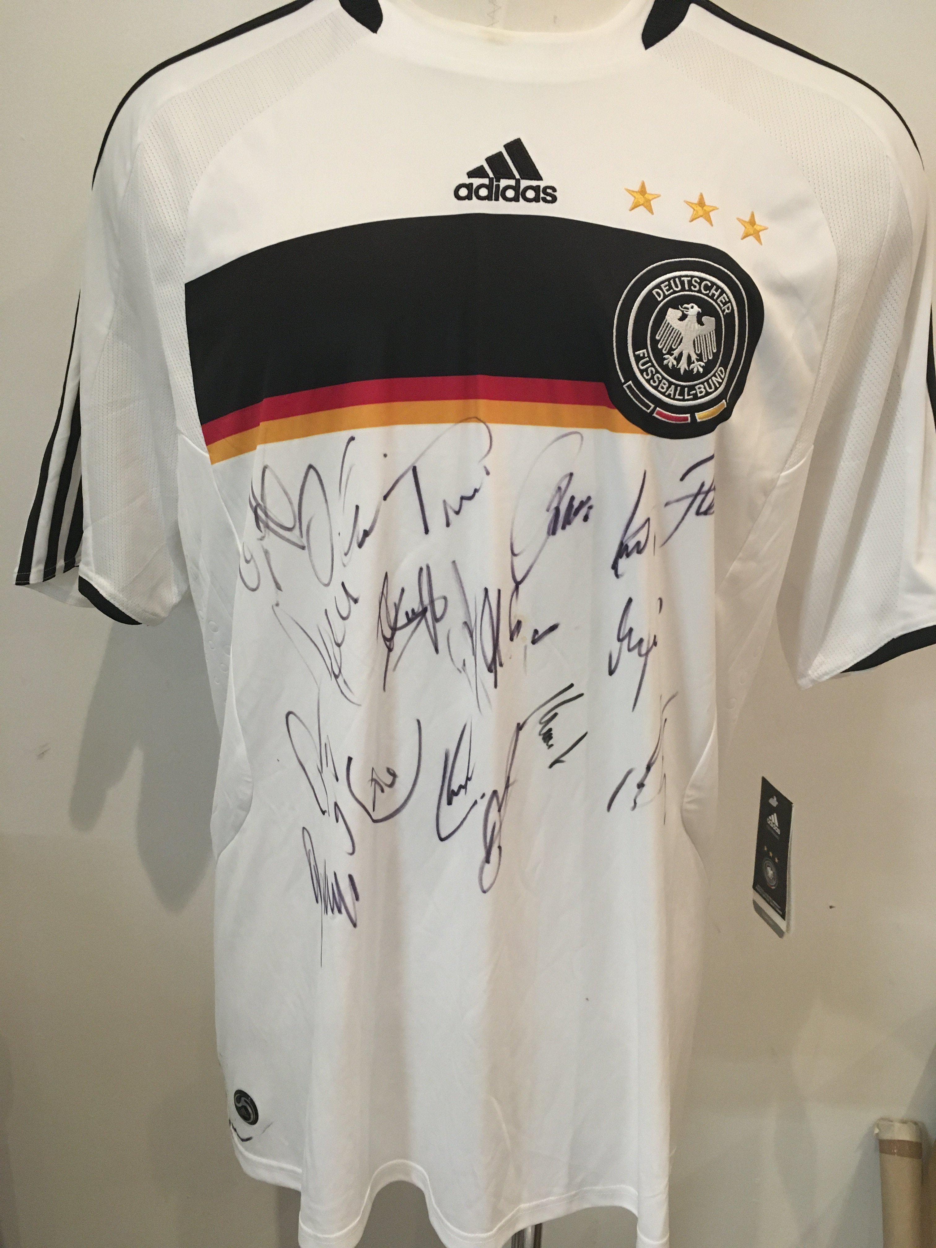 Euro 2008 Germany Signed Football Shirt: Replica shirt signed by around 15 of the finalists. Size 2xl white Adidas shirt is brand new with tags.