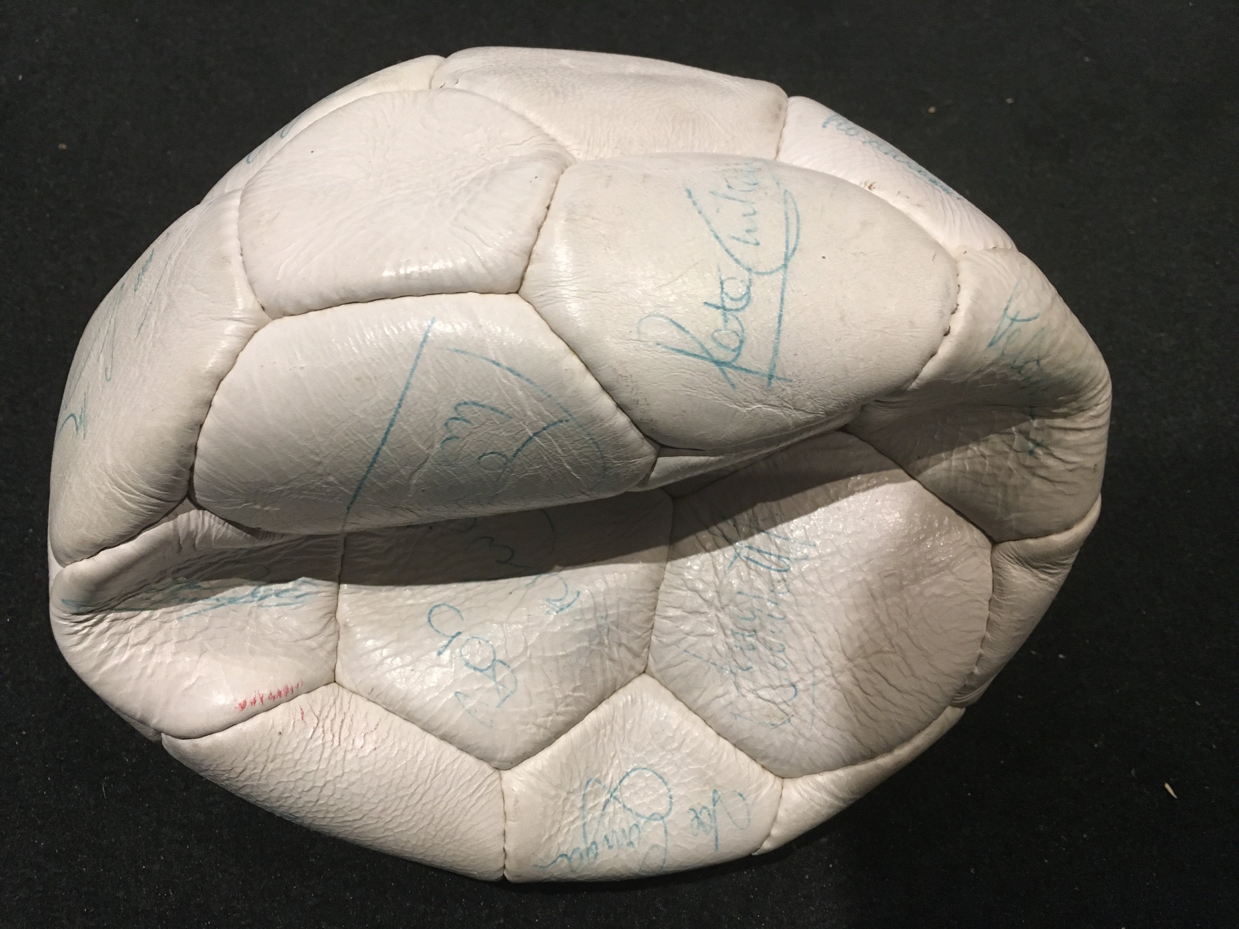 1978 England Squad Signed Football + More: White deflated panelled ball with around 18 autographs in green biro. Includes Shilton Latchford Brooking Coppell Keegan Neal and Kennedy. C/W original posters for World Cup England 1966 and 1970. Instructions to sell. (3)