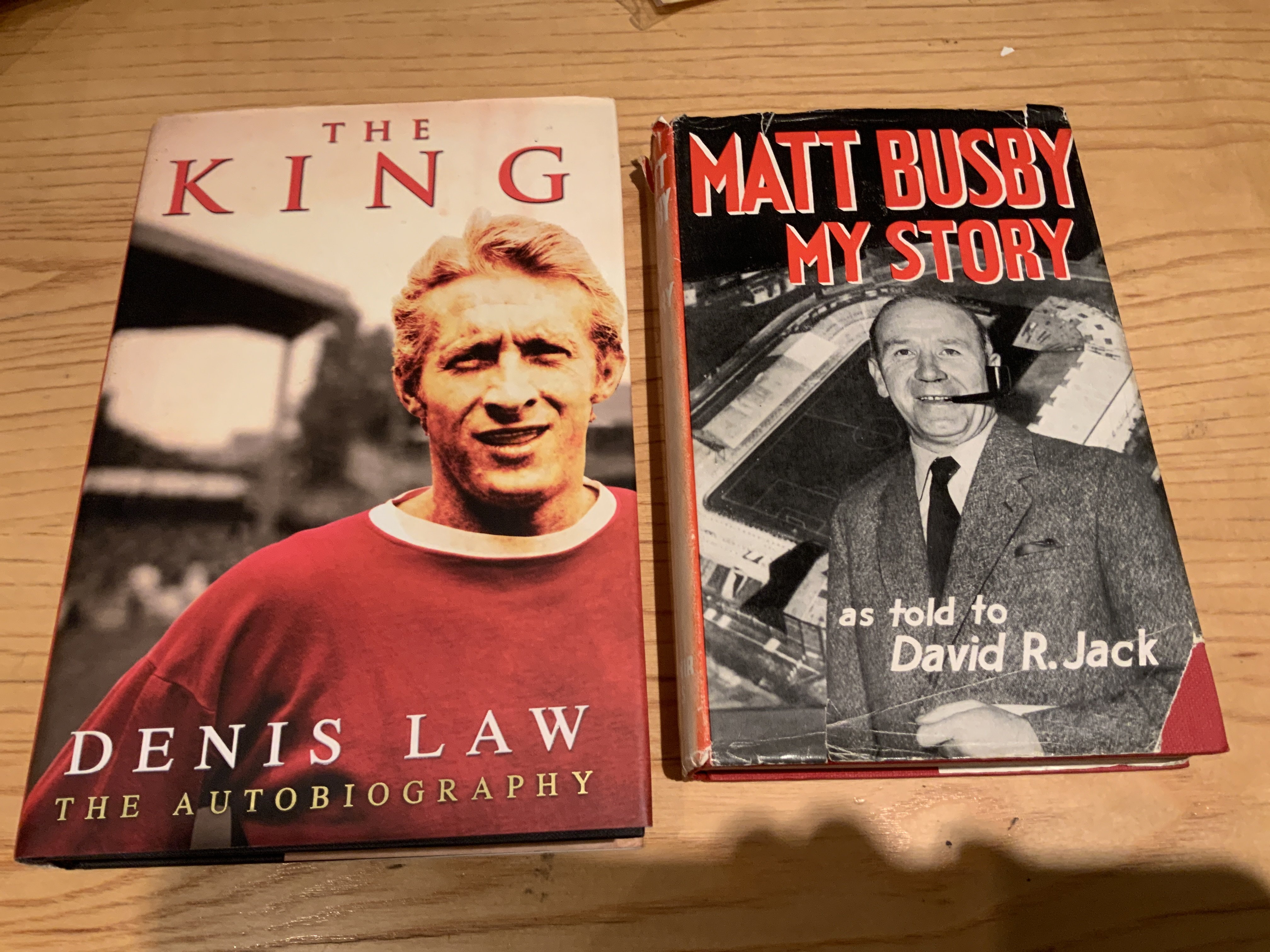 Matt Busby + Denis Law Signed Manchester United Football Books: Both books hand signed without dedication. Busby book has fading to spines dust jacket. (2)