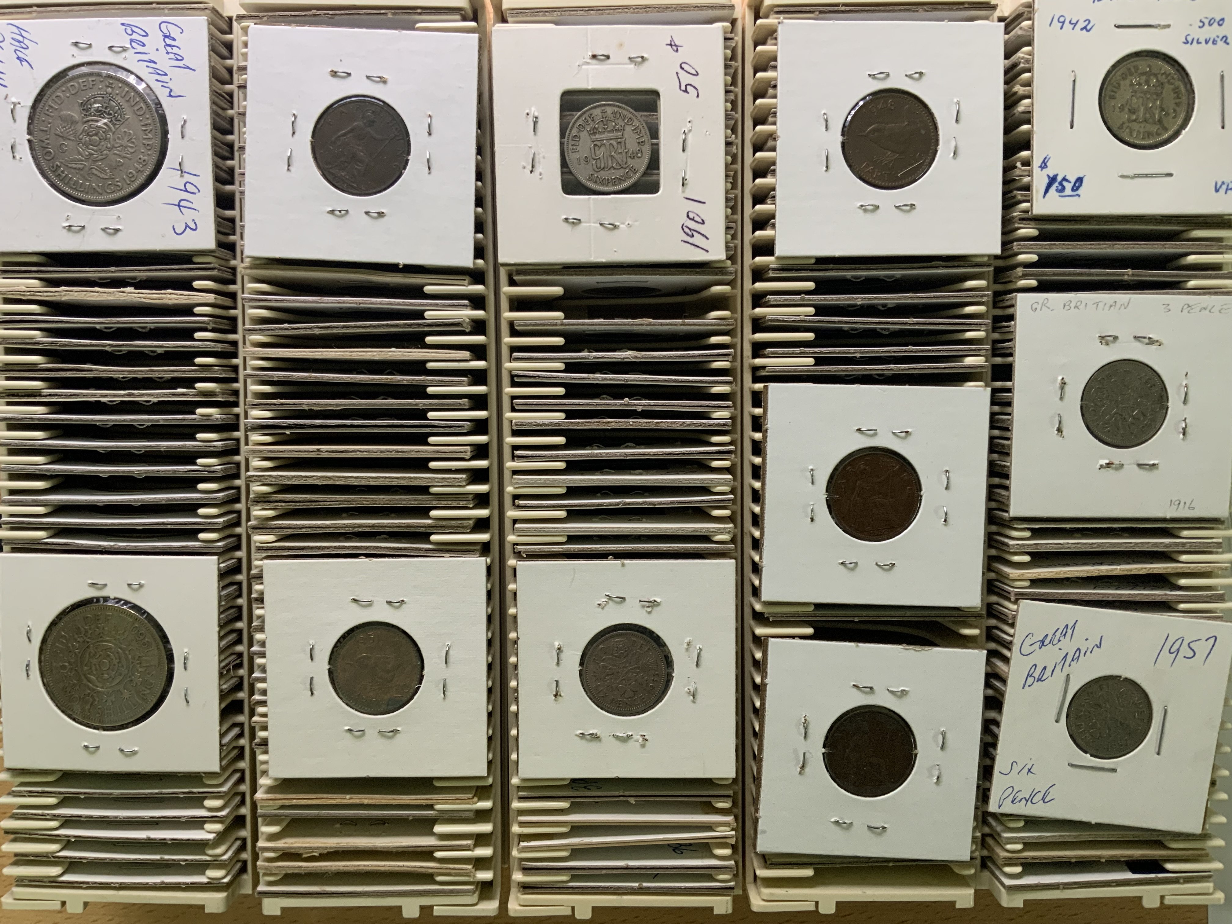 A collection of British coinage of various denominations.