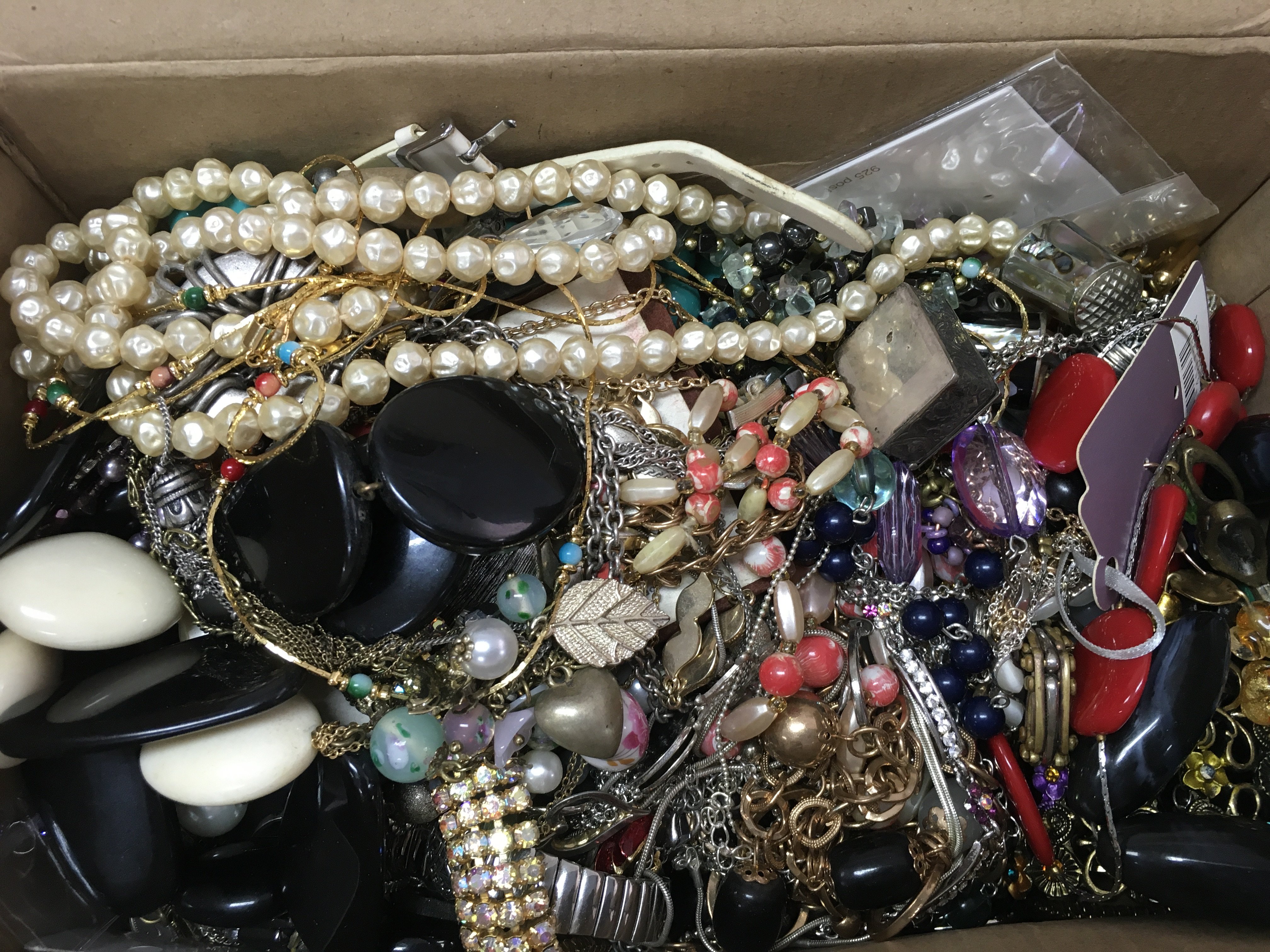 A box of costume jewellery including thimbles, cufflinks, brooches, necklaces etc, no reserve . Postage category B