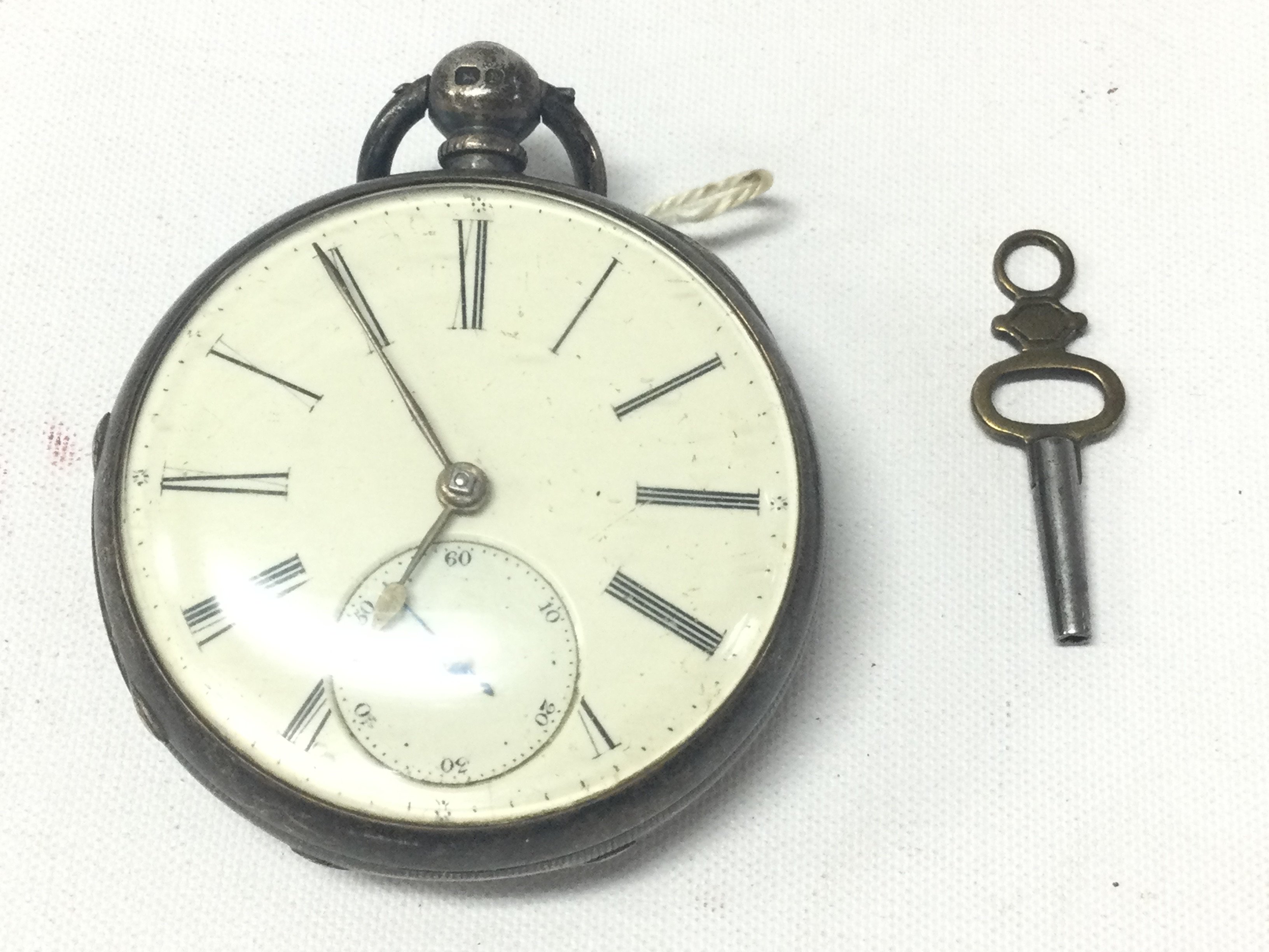 Silver fusee pocket watch and key