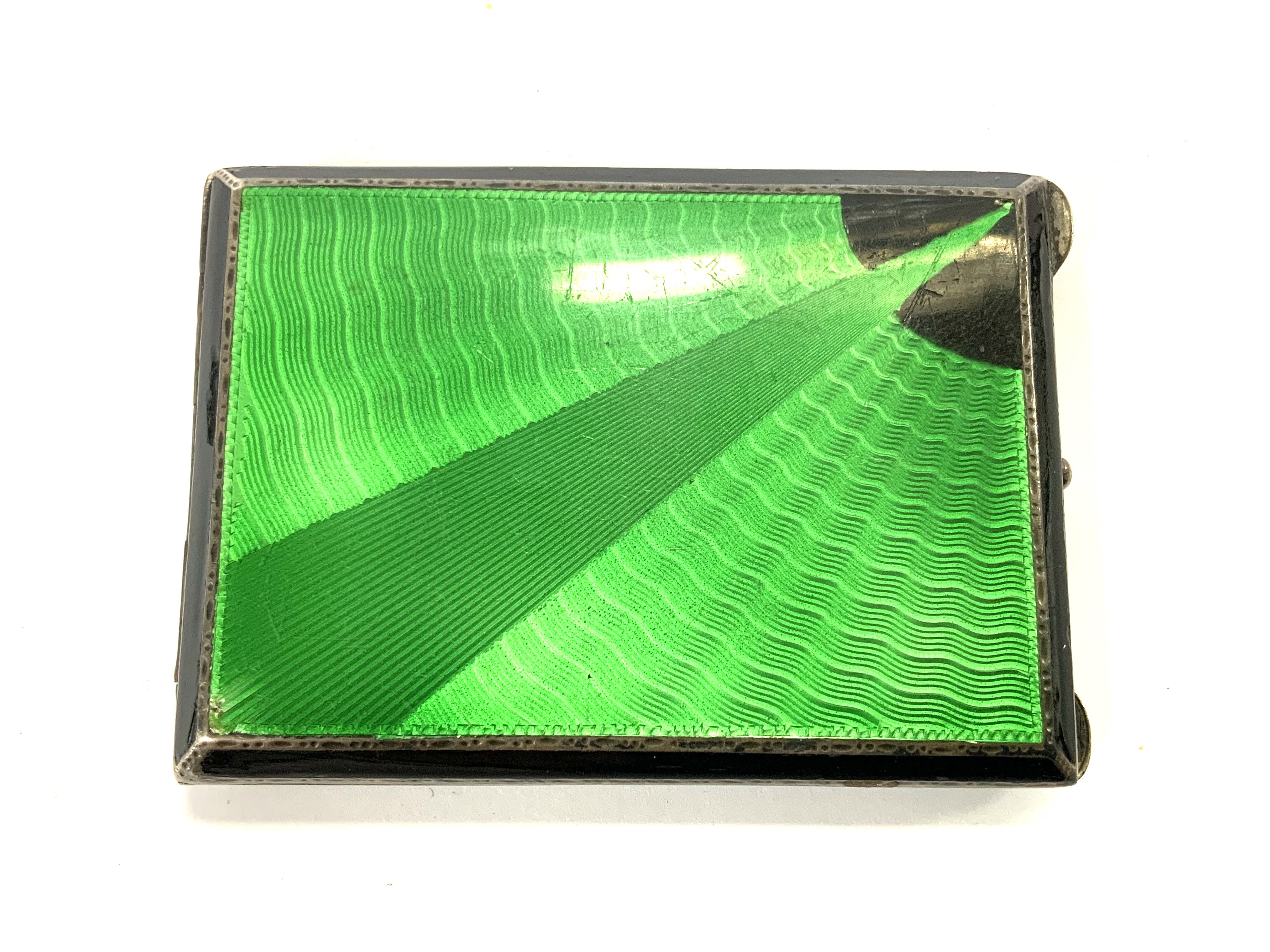 A small hallmarked silver and enamel art deco case. 5.8cm x 4.2cm