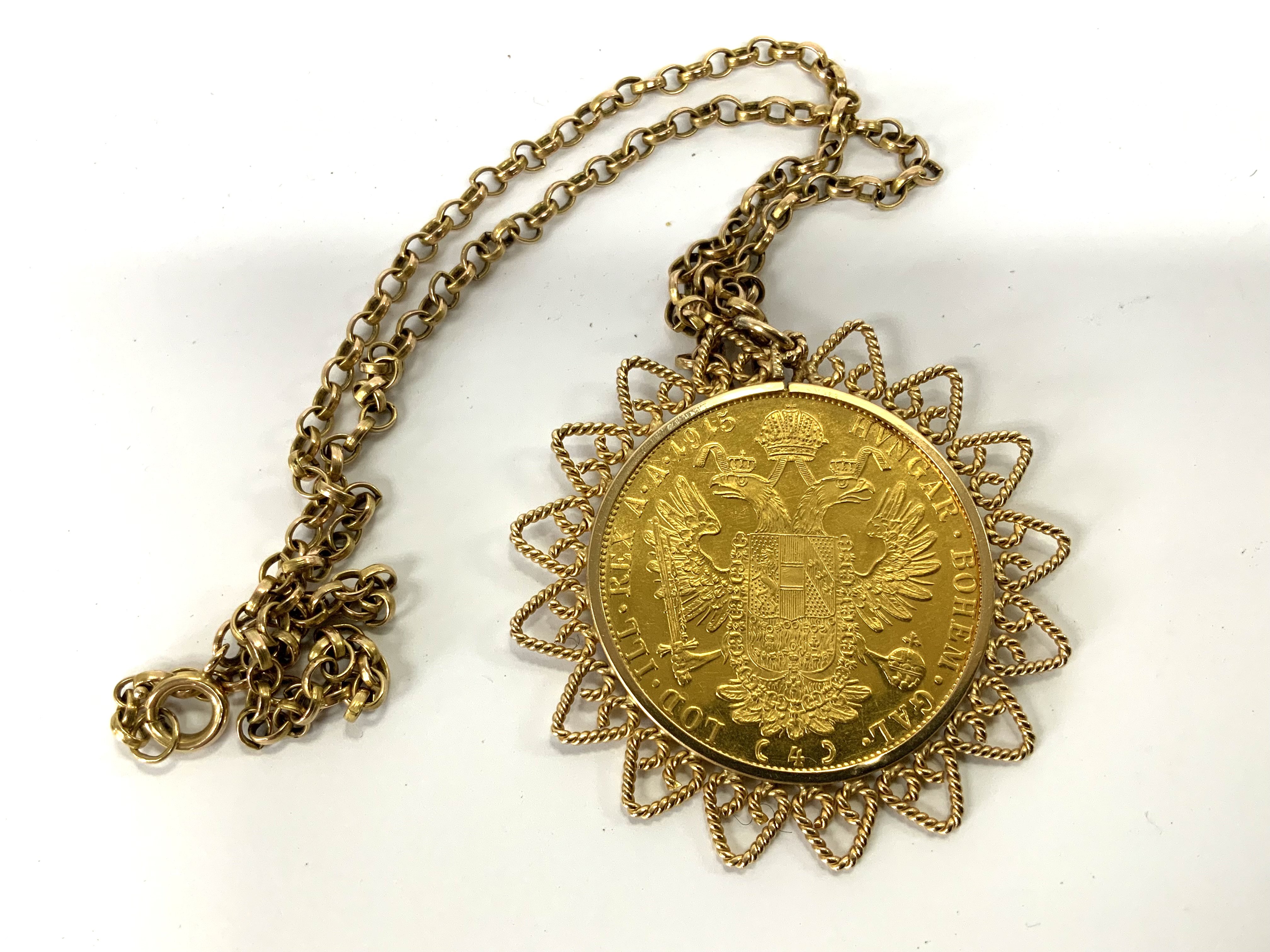 Austrian, 4 Ducat gold coin, 1915 together with a 9ct gold coin mount and chain. 34.88g (A)