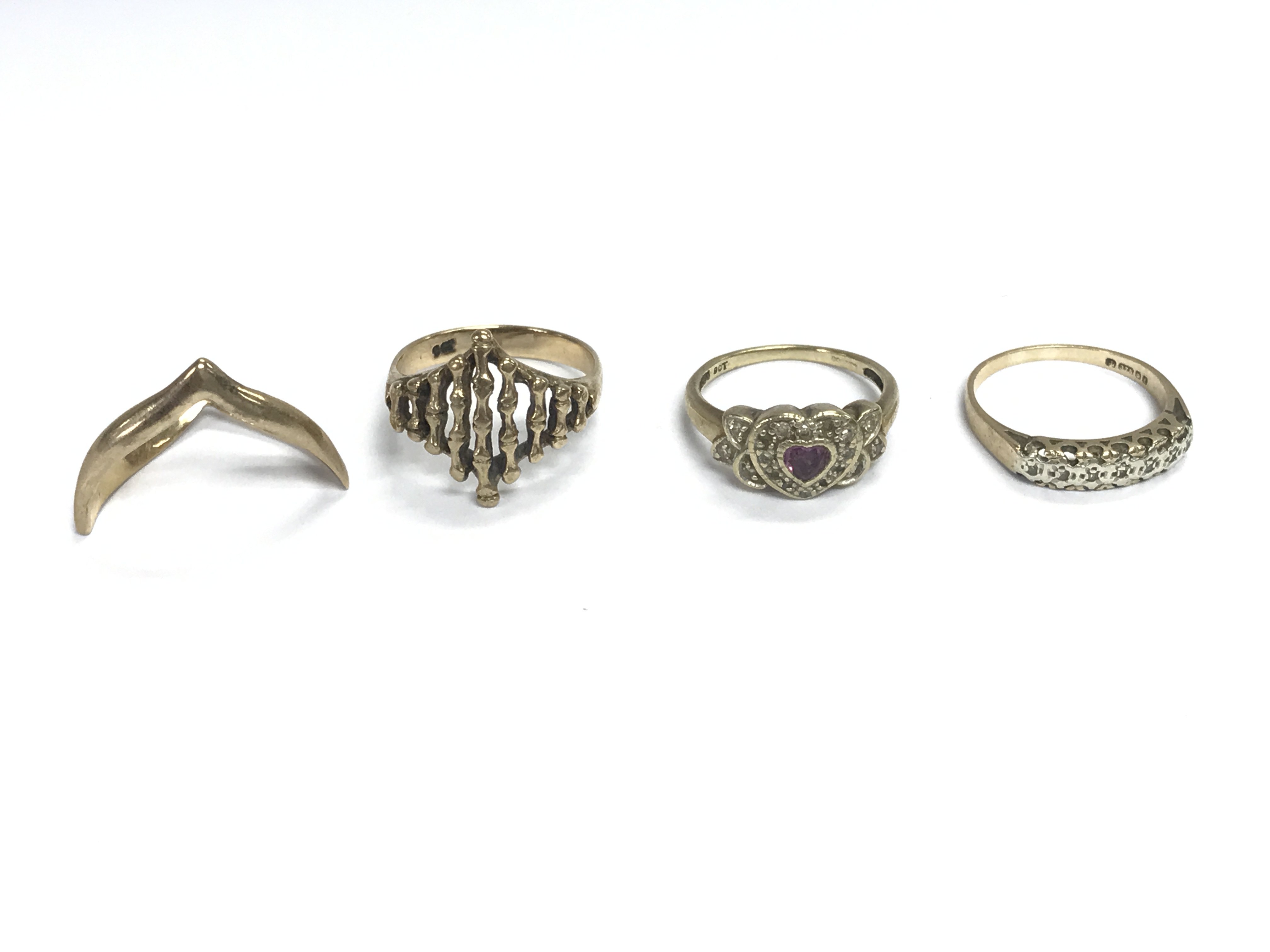 Four 9ct gold rings of various designs. 11.52g total