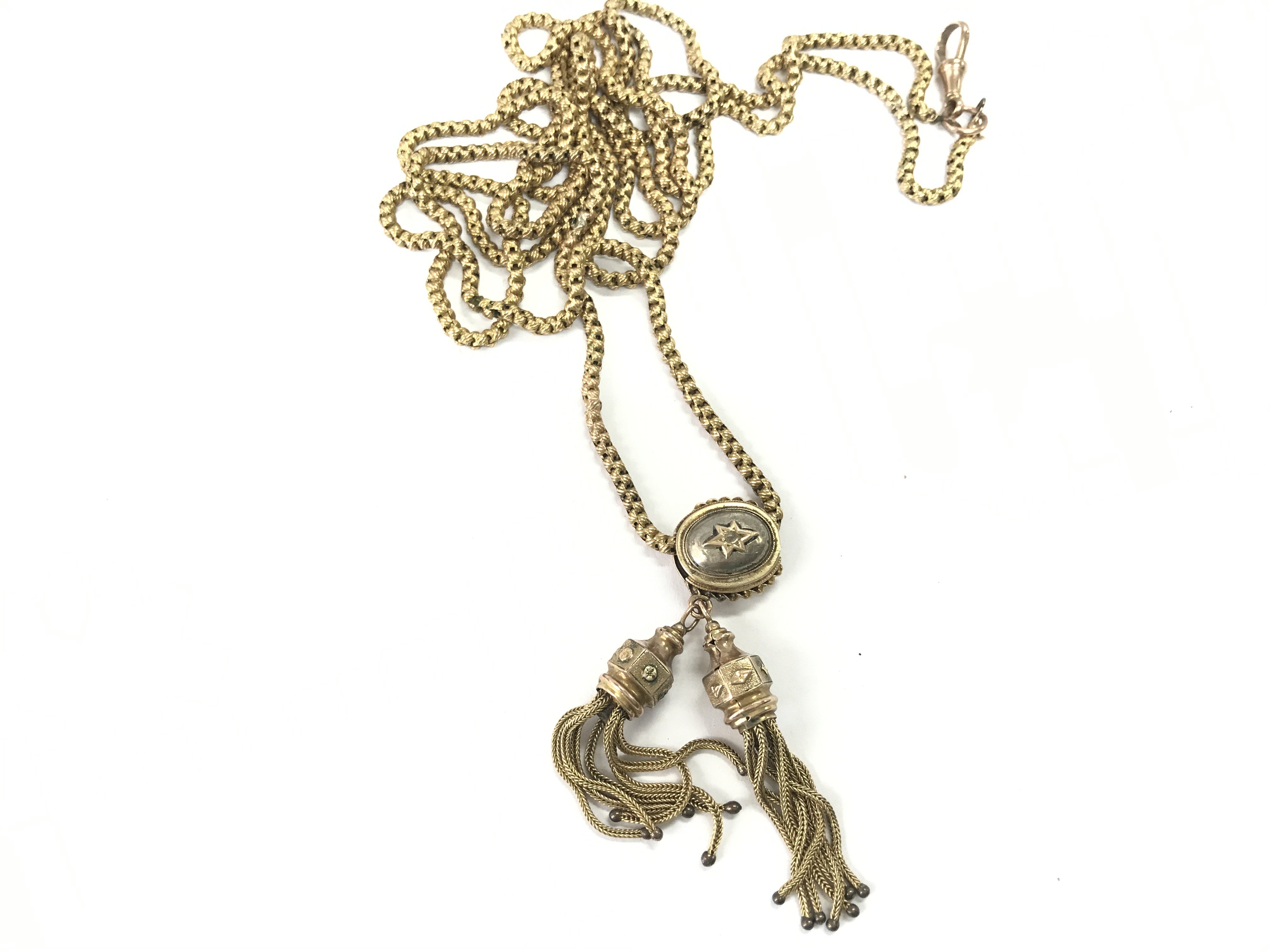 A Edwardian 9ct gold muff chain. There have been some repairs to the chain. 35.06g Postage B