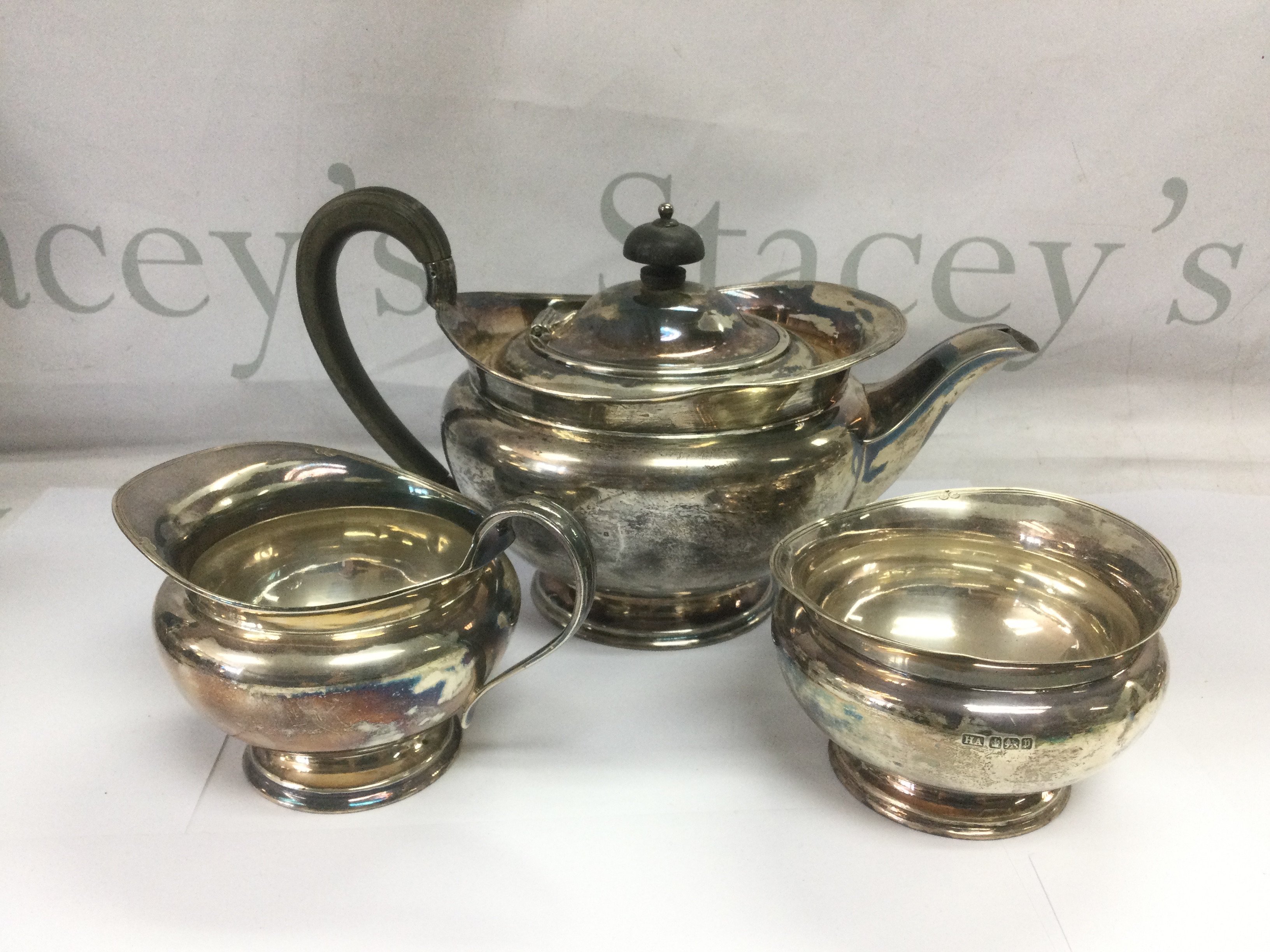 A three piece silver tea set, Sheffield hallmarks, approx 1kg. Shipping category B.