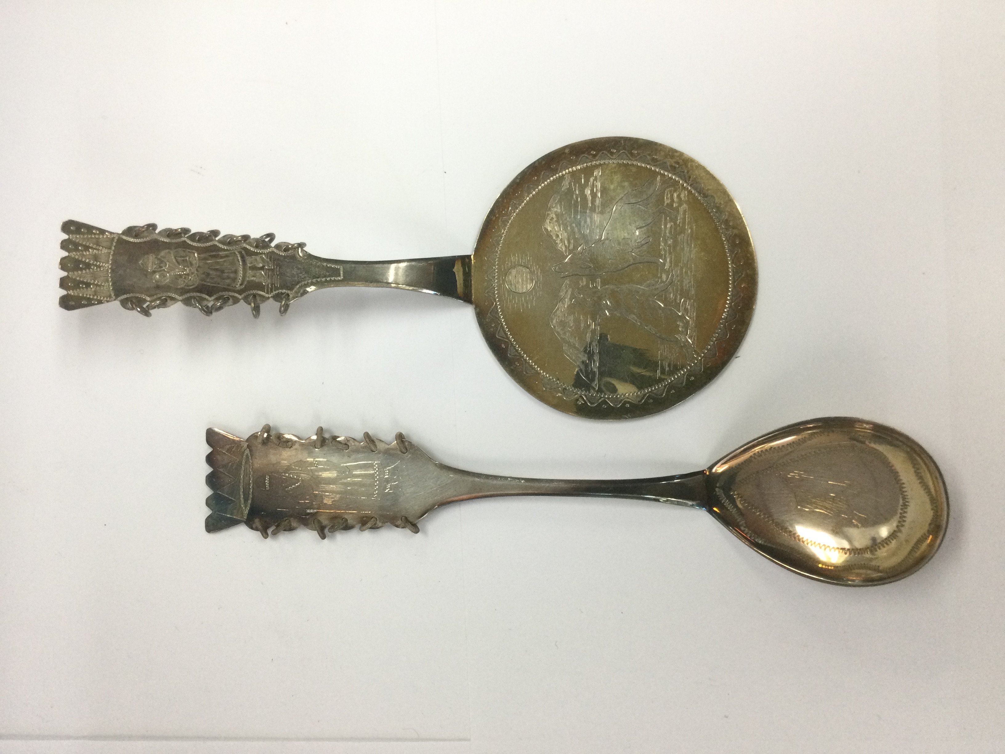 Two Danish silver items comprising a spoon and a slice. Shipping category B.