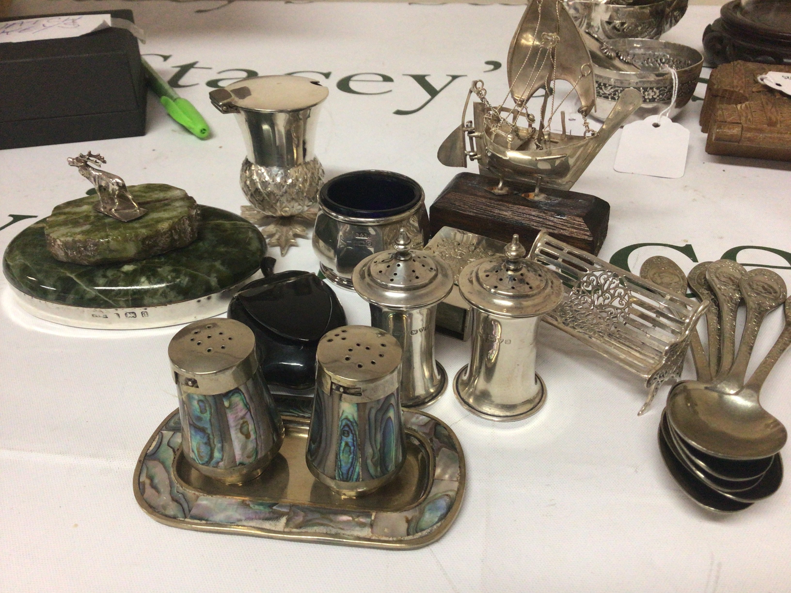 A miniature silver bench silver condiments and other oddments silver plated commemorative spoons.