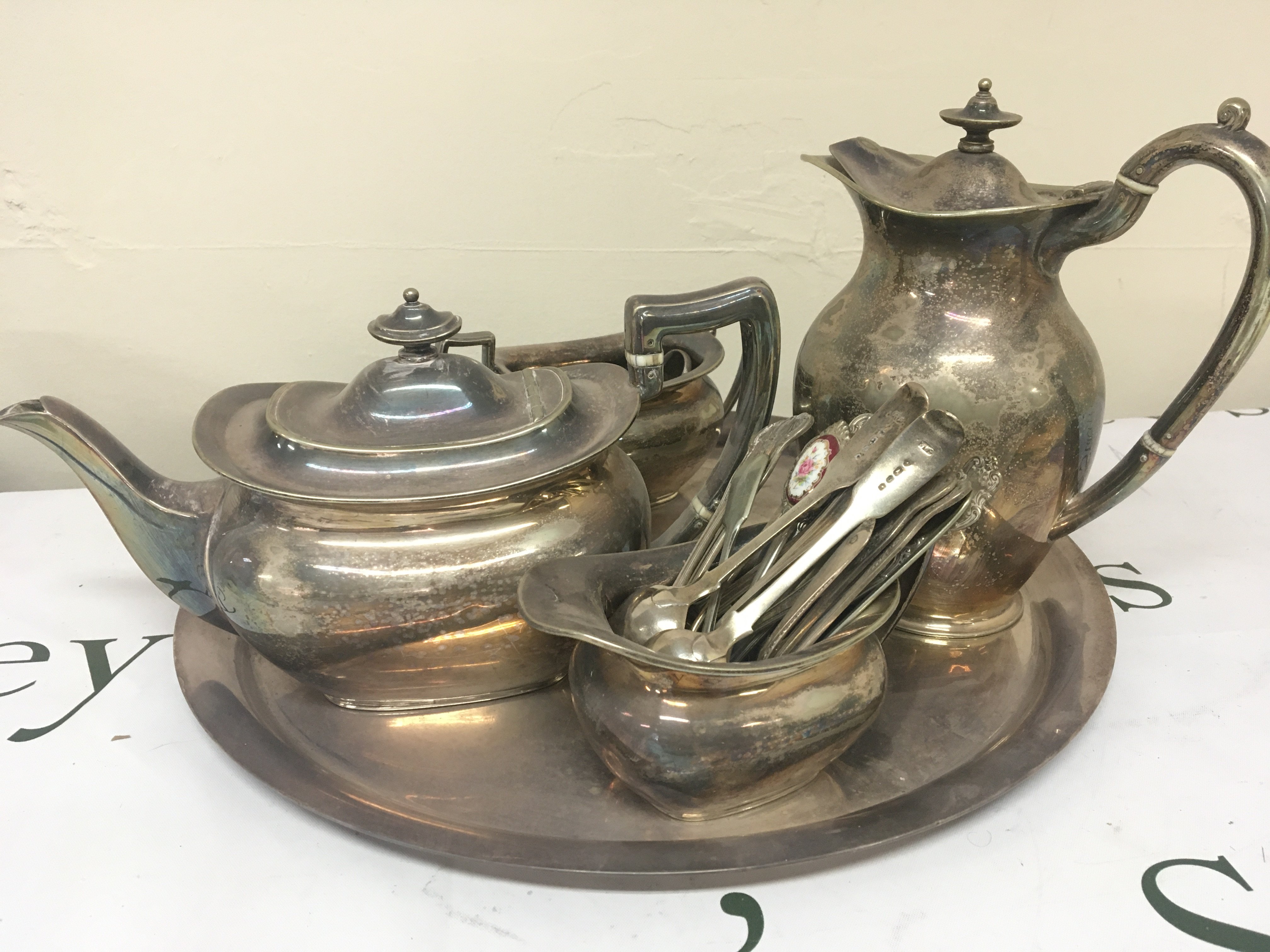 Silver plated tea tea set a condiment set silver and silver plated spoons.