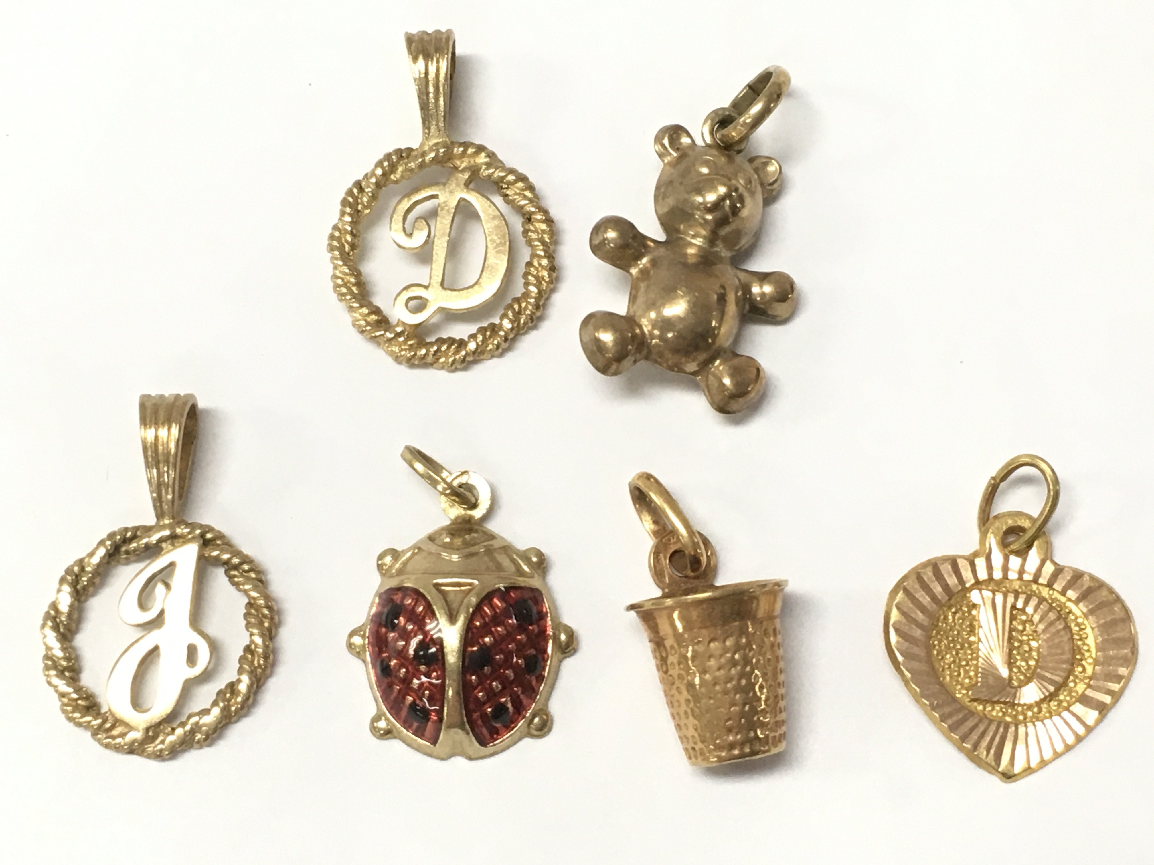A collection of 9ct gold charms