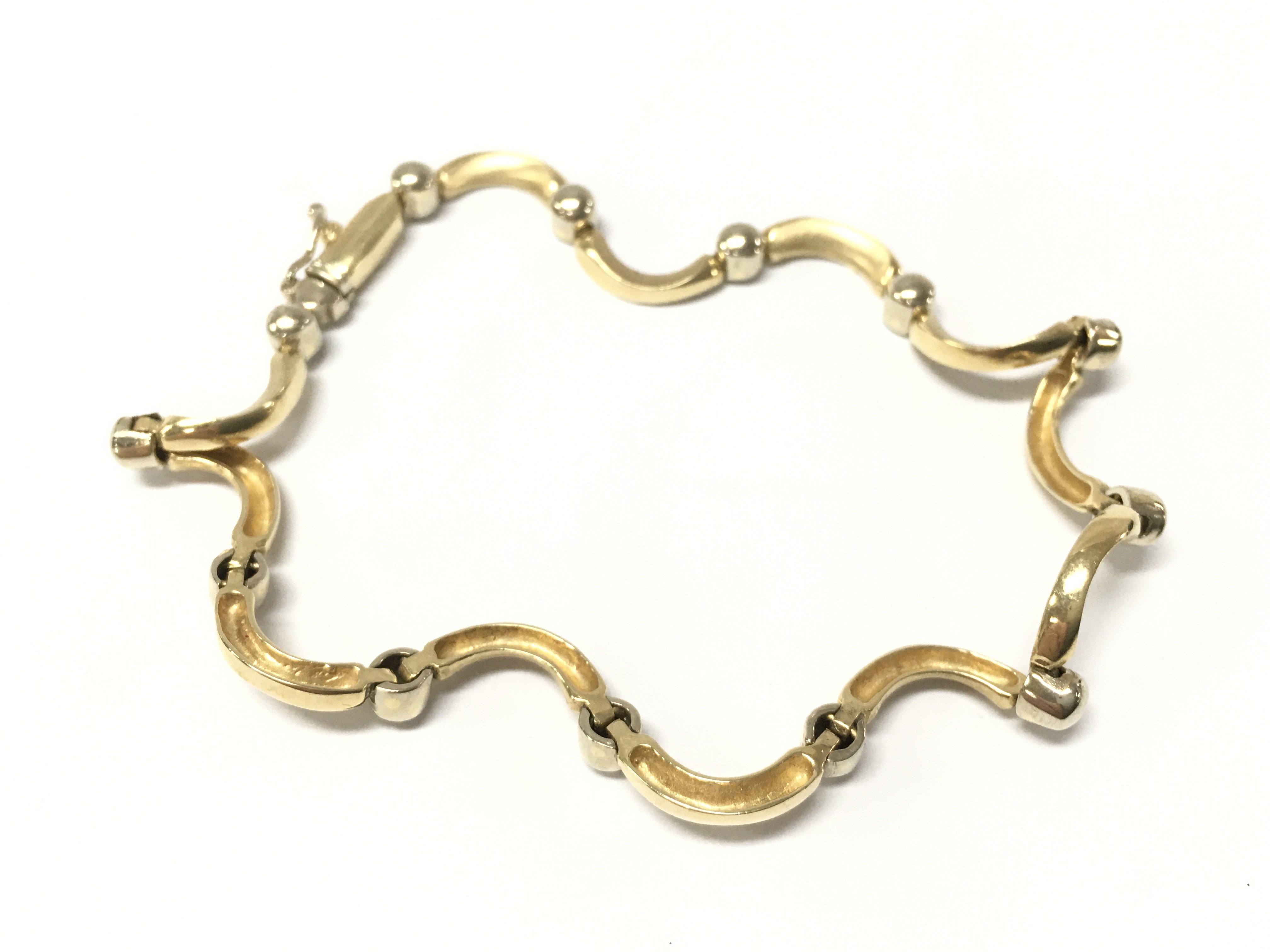 A 14ct gold fancy bracelet , 12g total weight postage category A