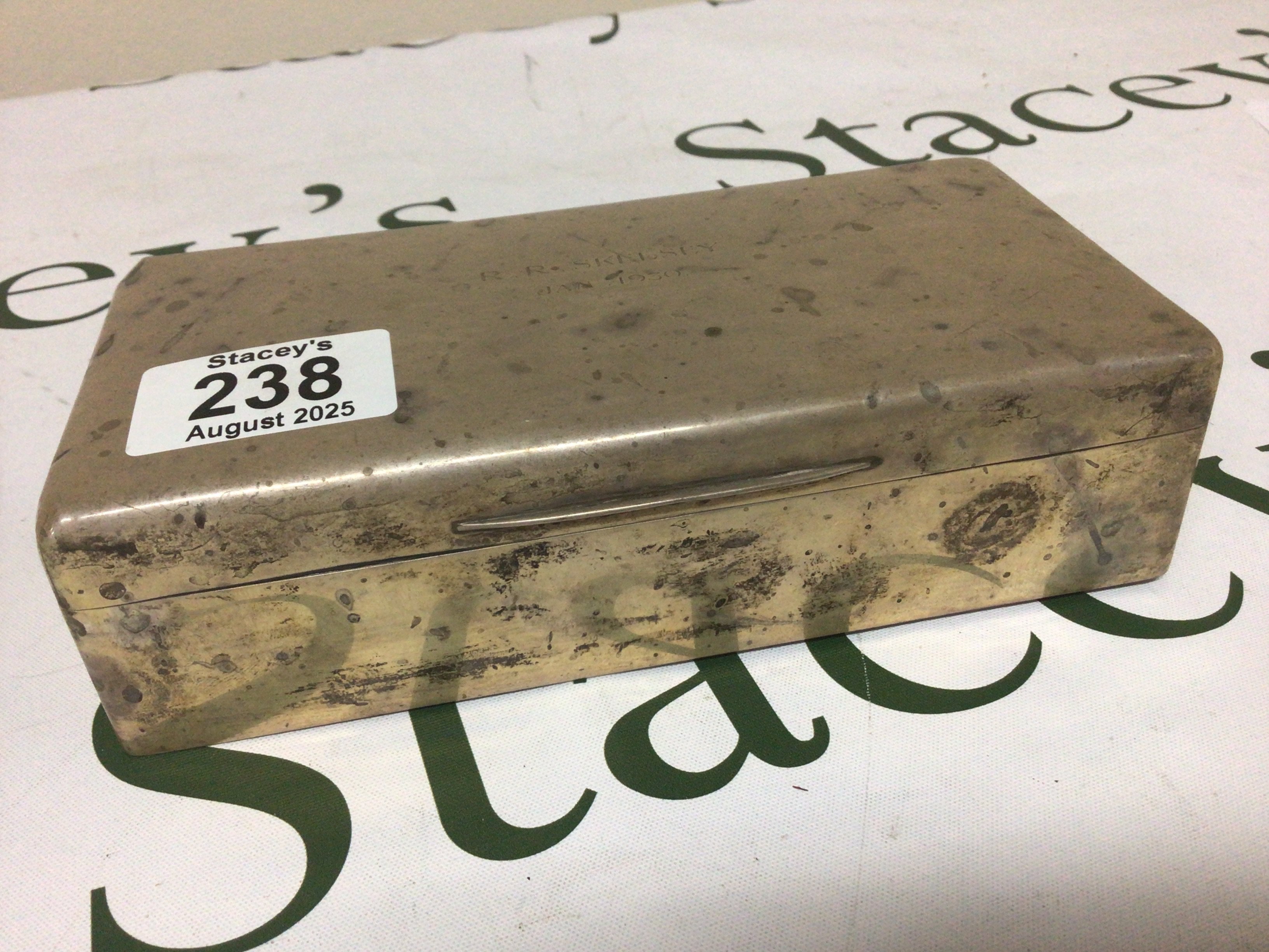 A Silver cigarette box of rectangular shape the top with an inscription and dated 1930 London hallmarks 18x9cm