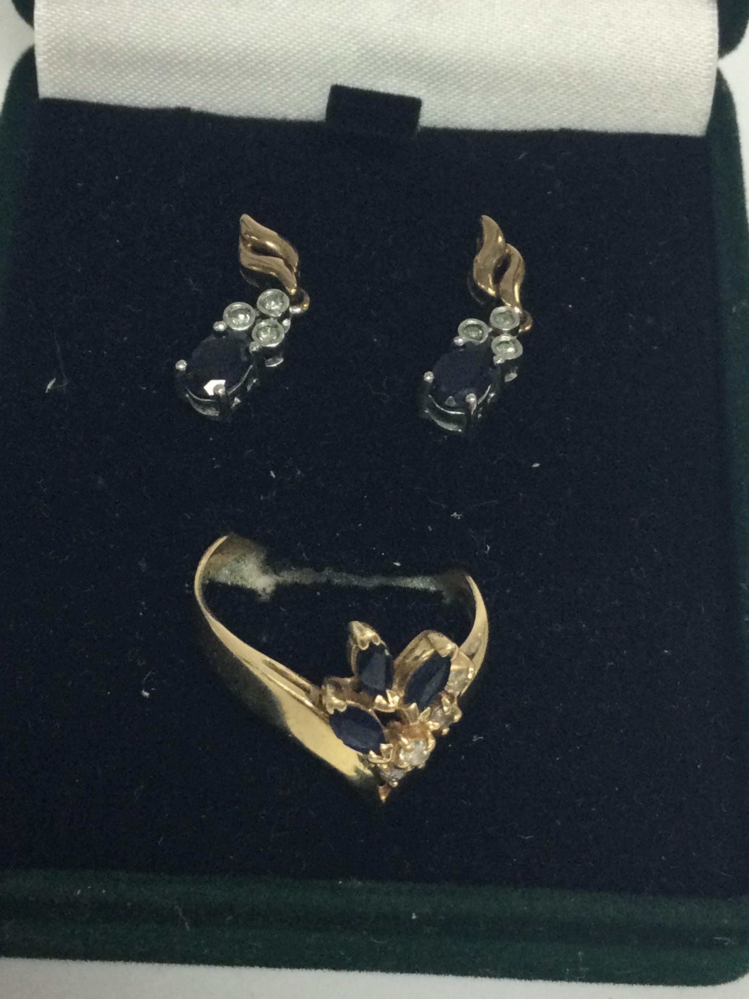 A gold ring inset with diamonds and sapphires together with gold sapphire and diamond earrings.