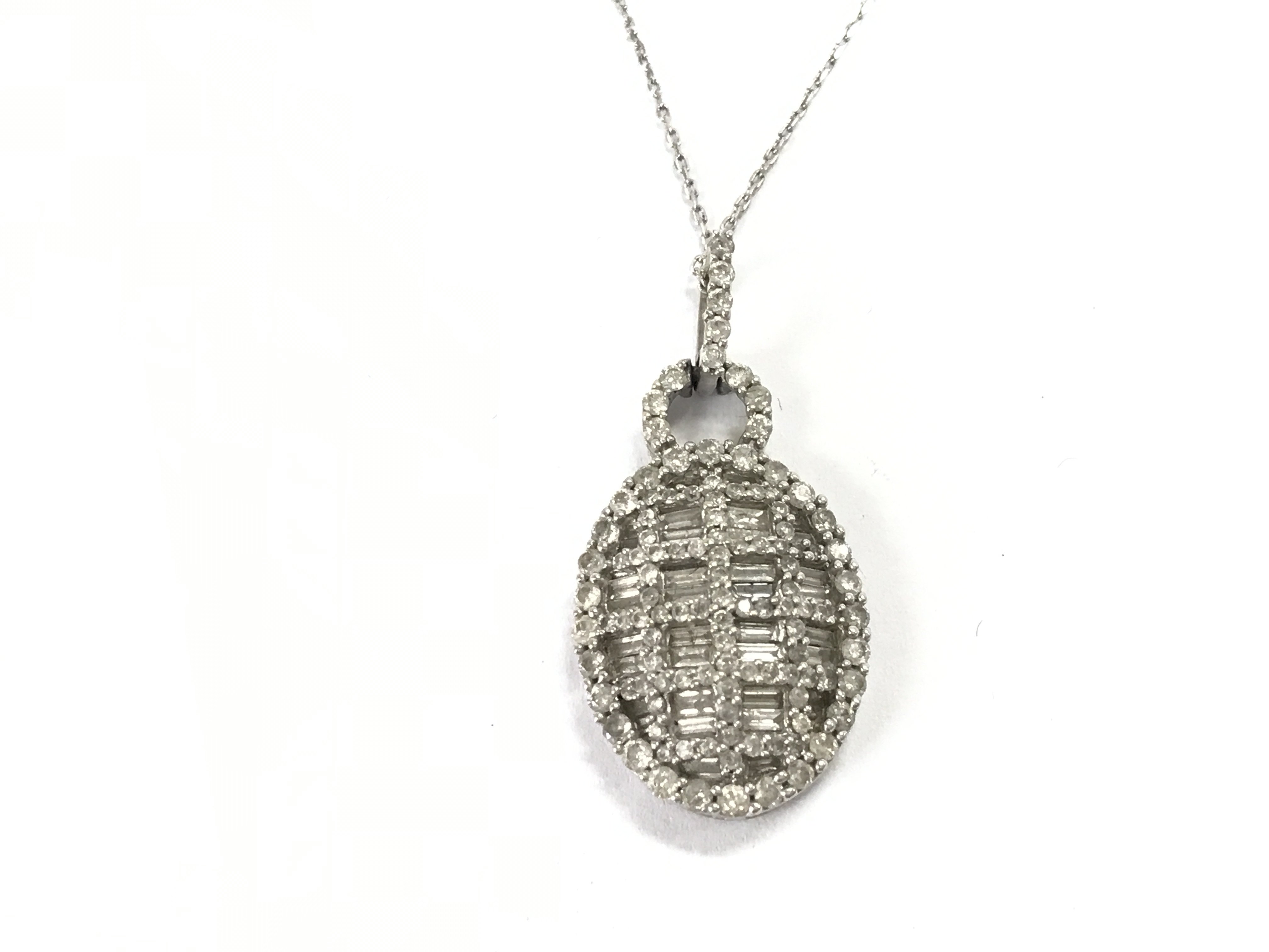 A 9ct white gold pendant set with 1.50ct of diamonds on a 9ct white gold chain.Postage A