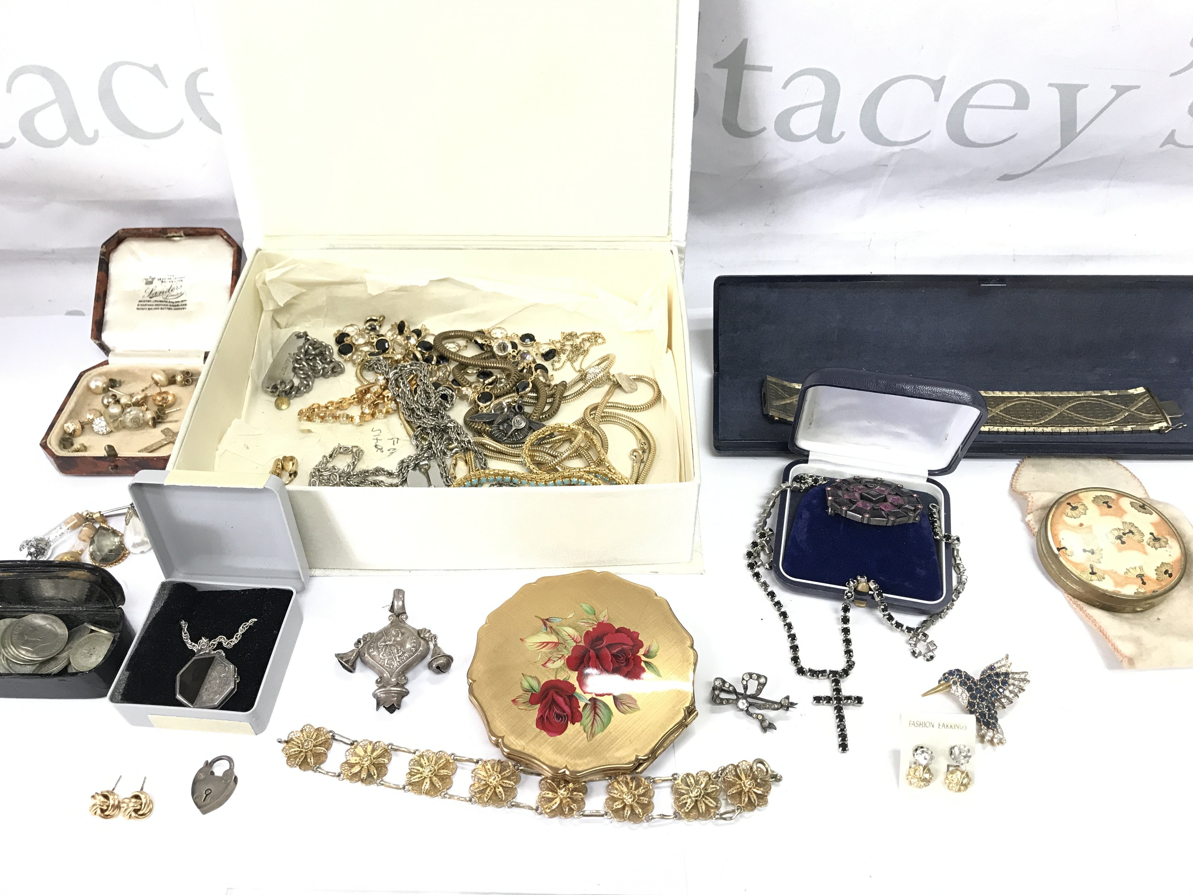 A collection of assorted costume jewellery including various silver and gold items.