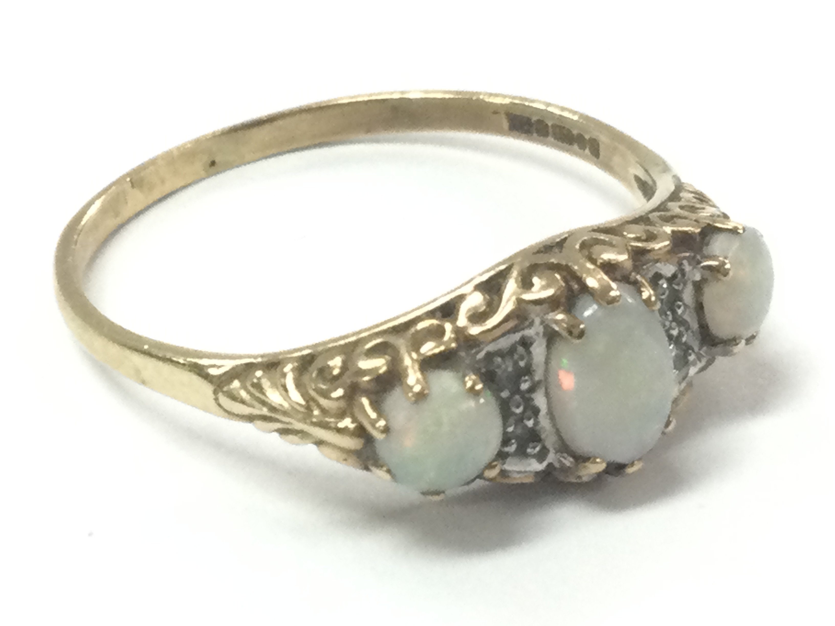 A three stone opal set ring , 1.99g total weight. Size S Postage category A