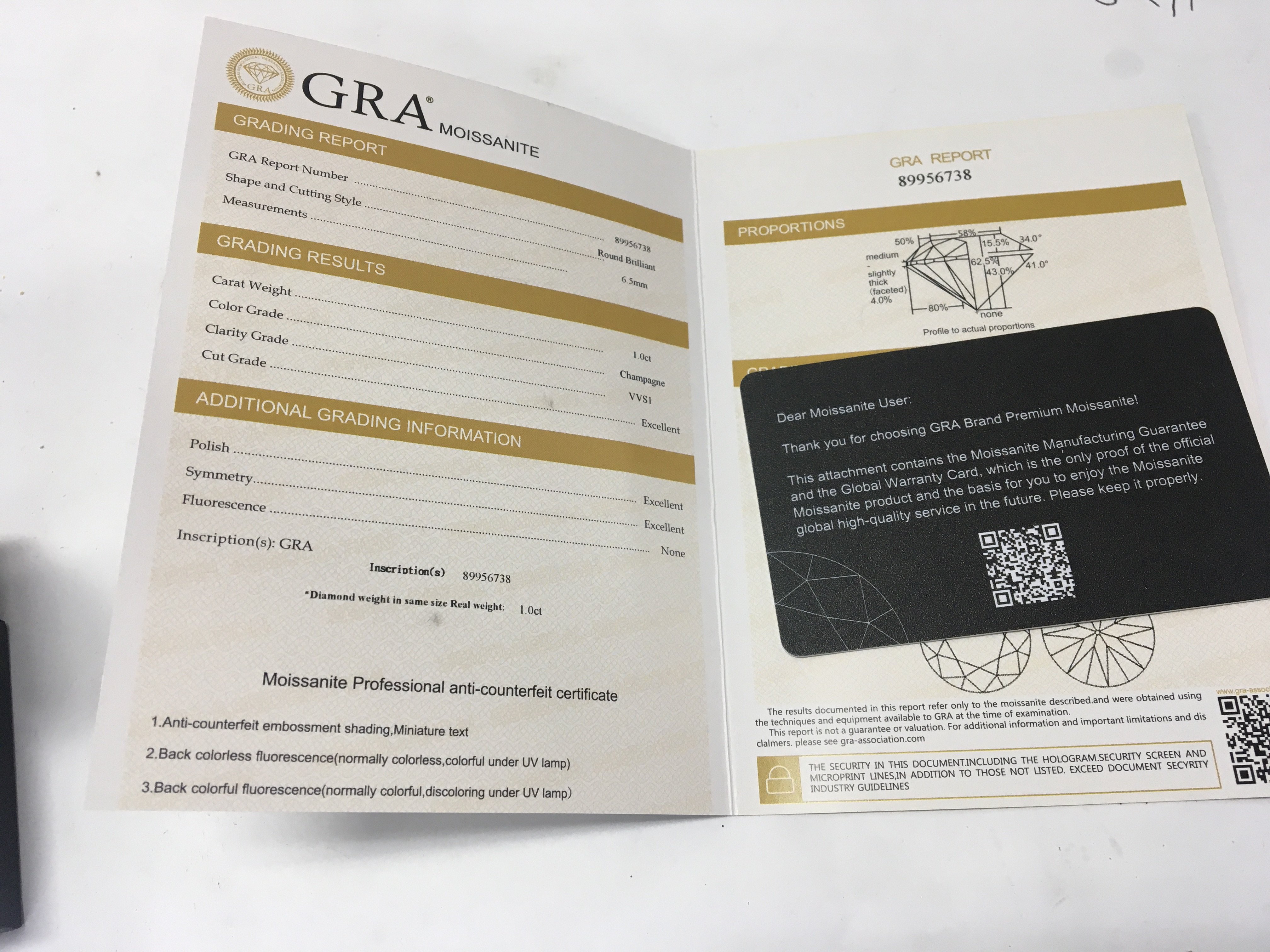 A 1ct Moissanite champagne solitaire ring with GRA report. Size N 1/2 in 925 silver ring.