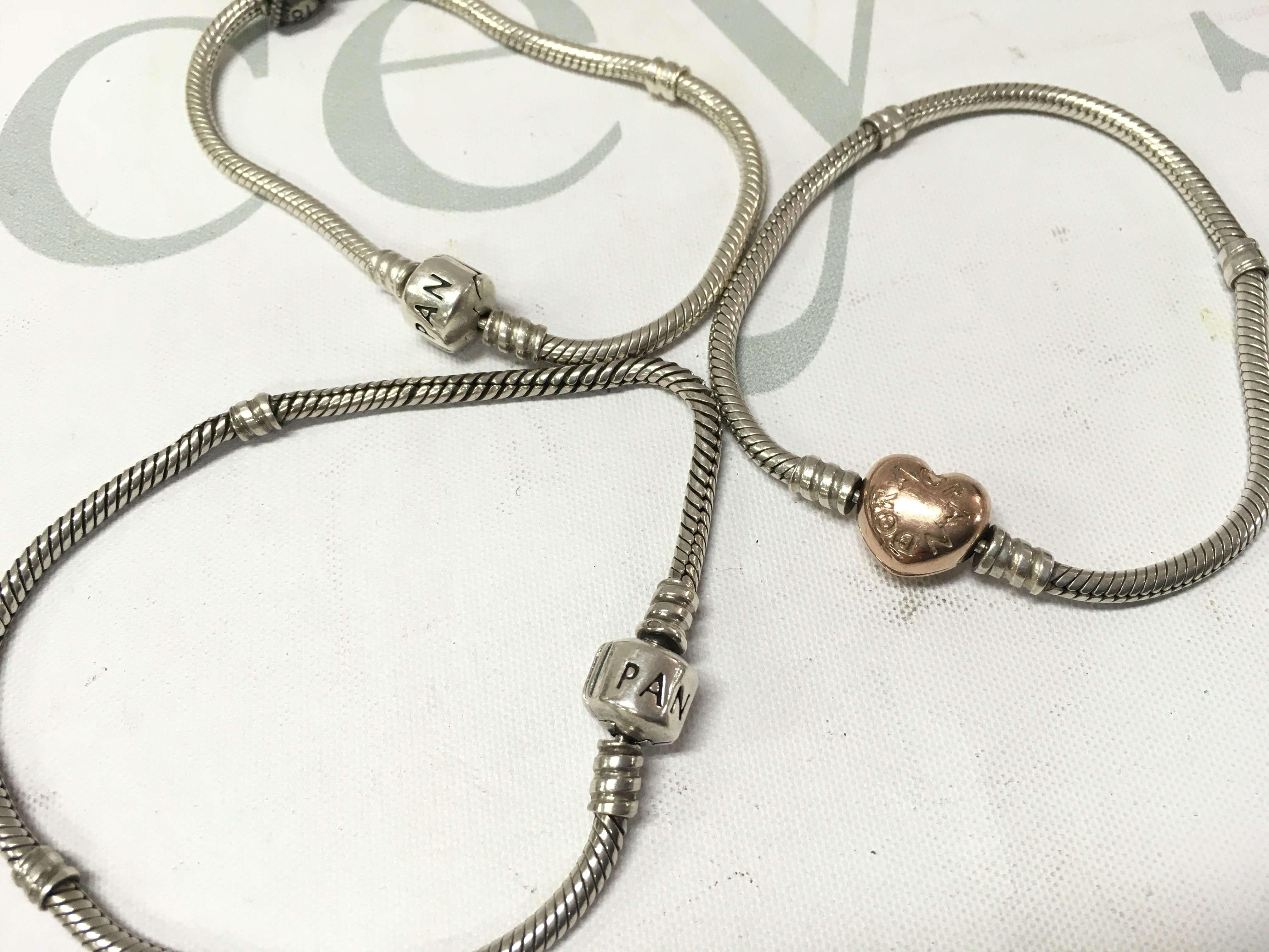Three silver pandora bracelets. Postage A
