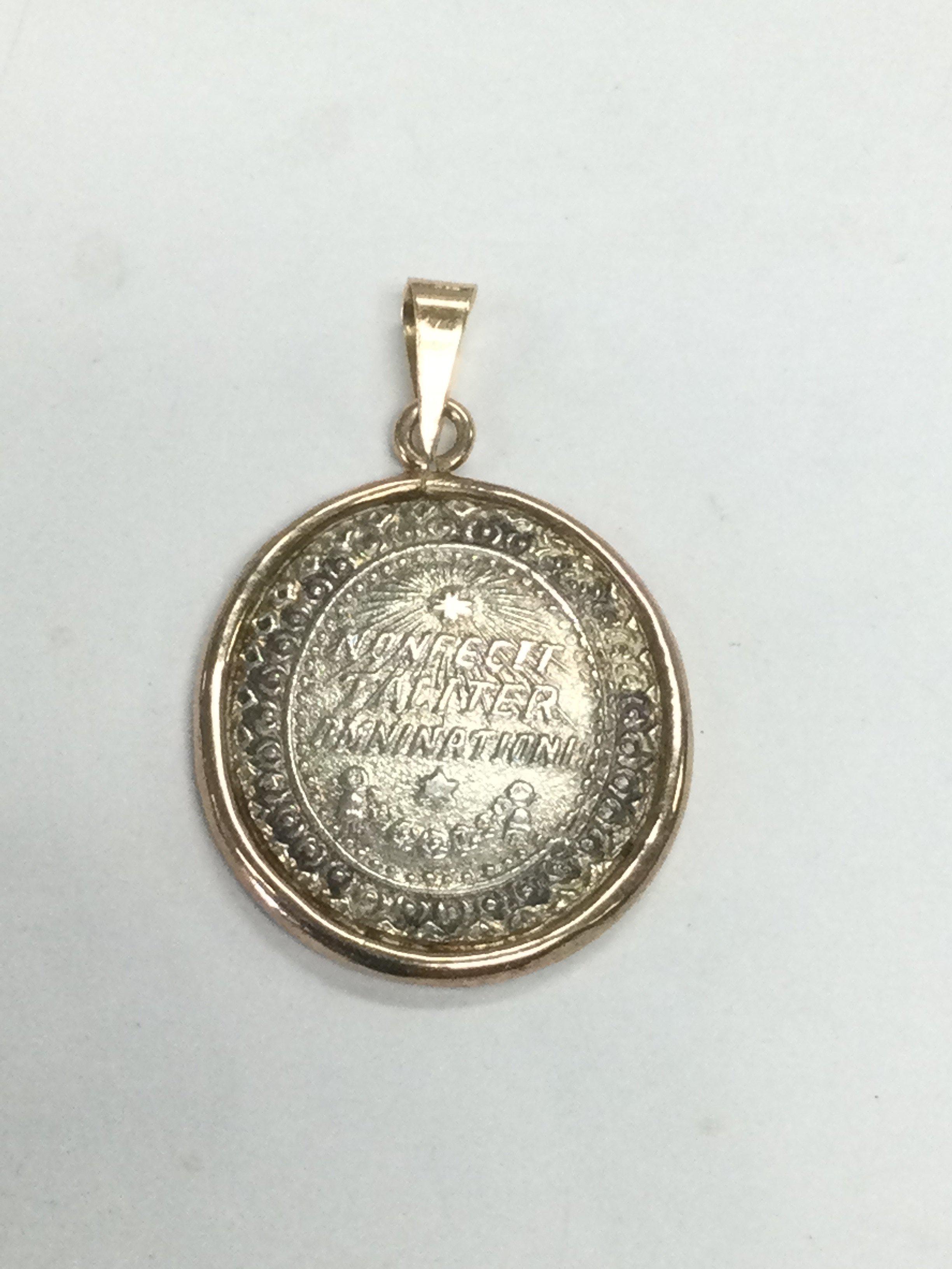 An 1807 gold and silver pendant, approx length 3cm. Shipping category A.