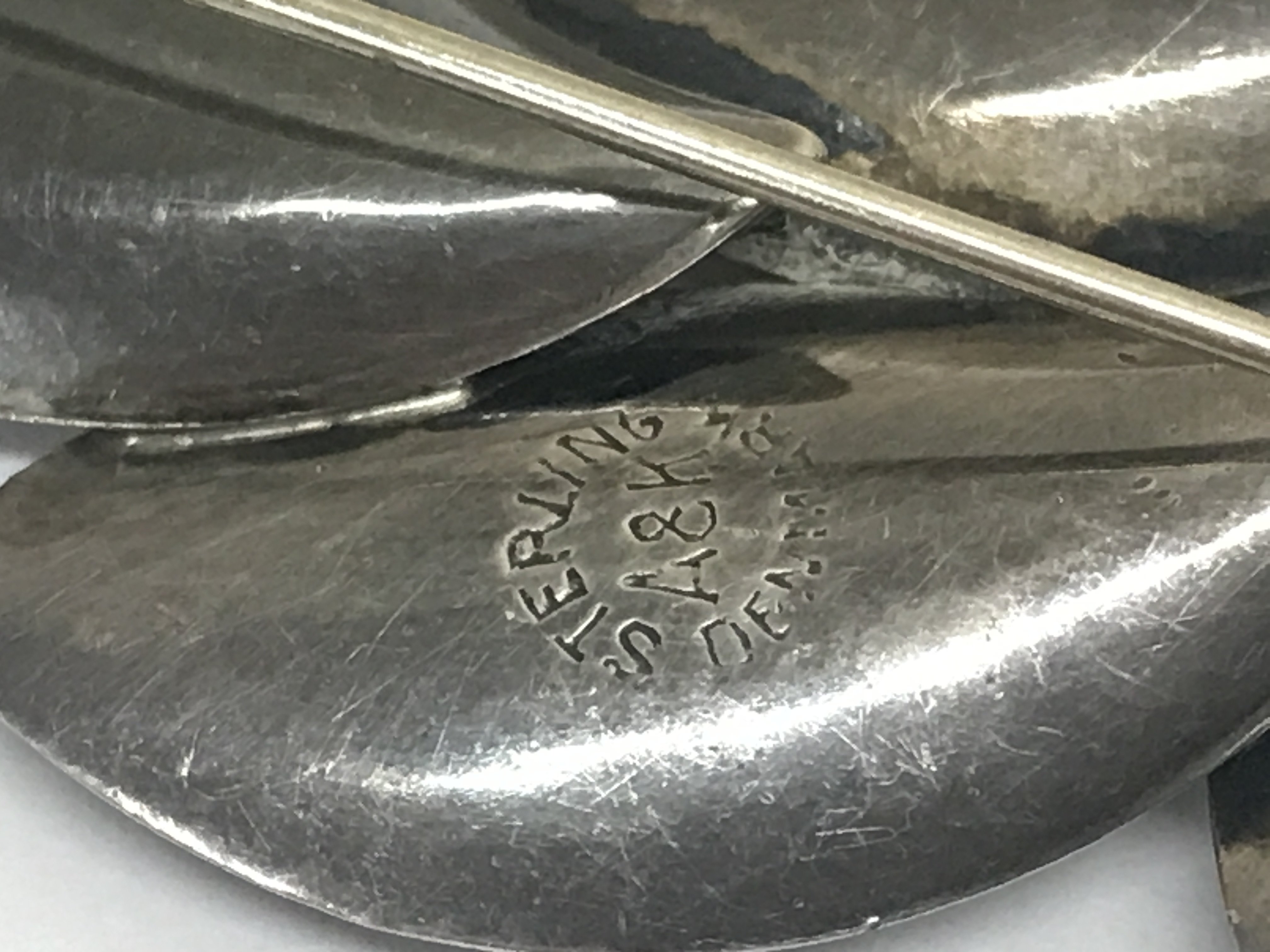 Anton Michelsen Rougie silver brooch, Aarre & Krogh Danish brooch and a silver enamel Viking boat brooch . Postage category B- NO RESERVE