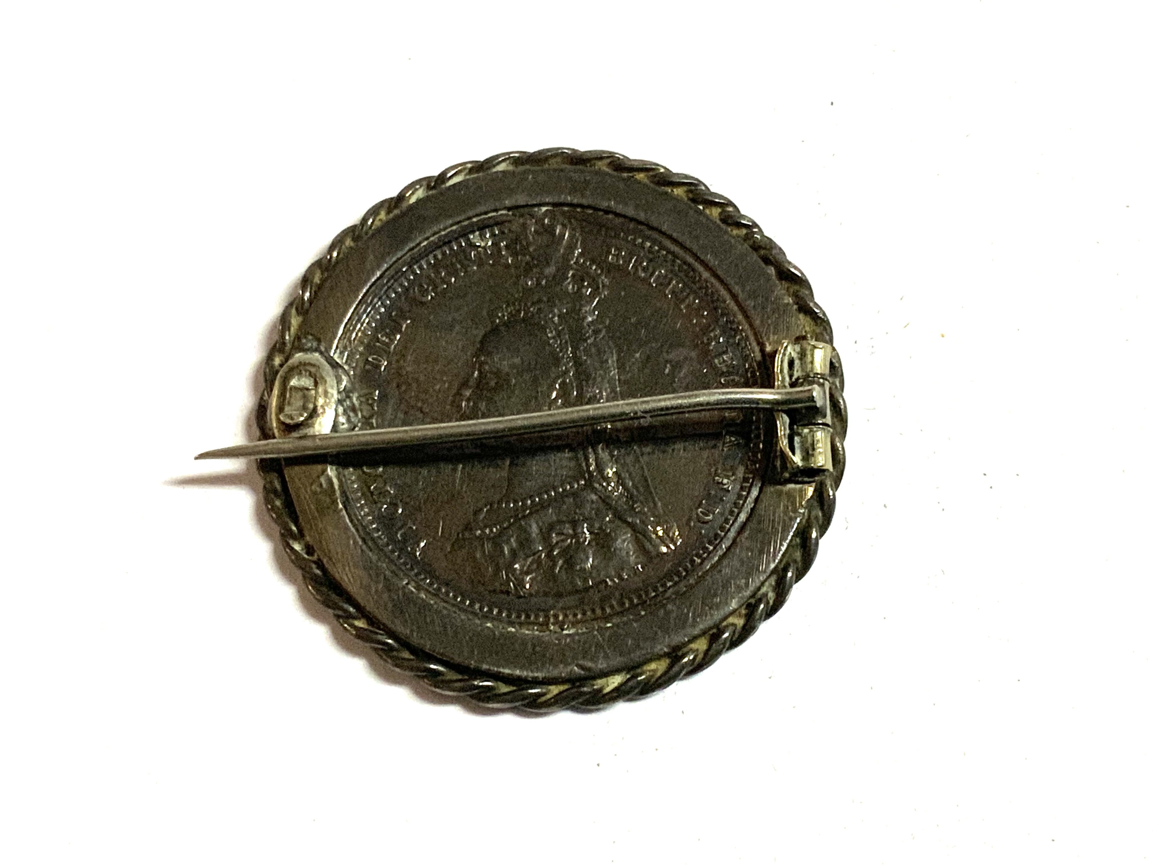 An 1887 Jubilee sixpence in silver brooch mount.- NO RESERVE