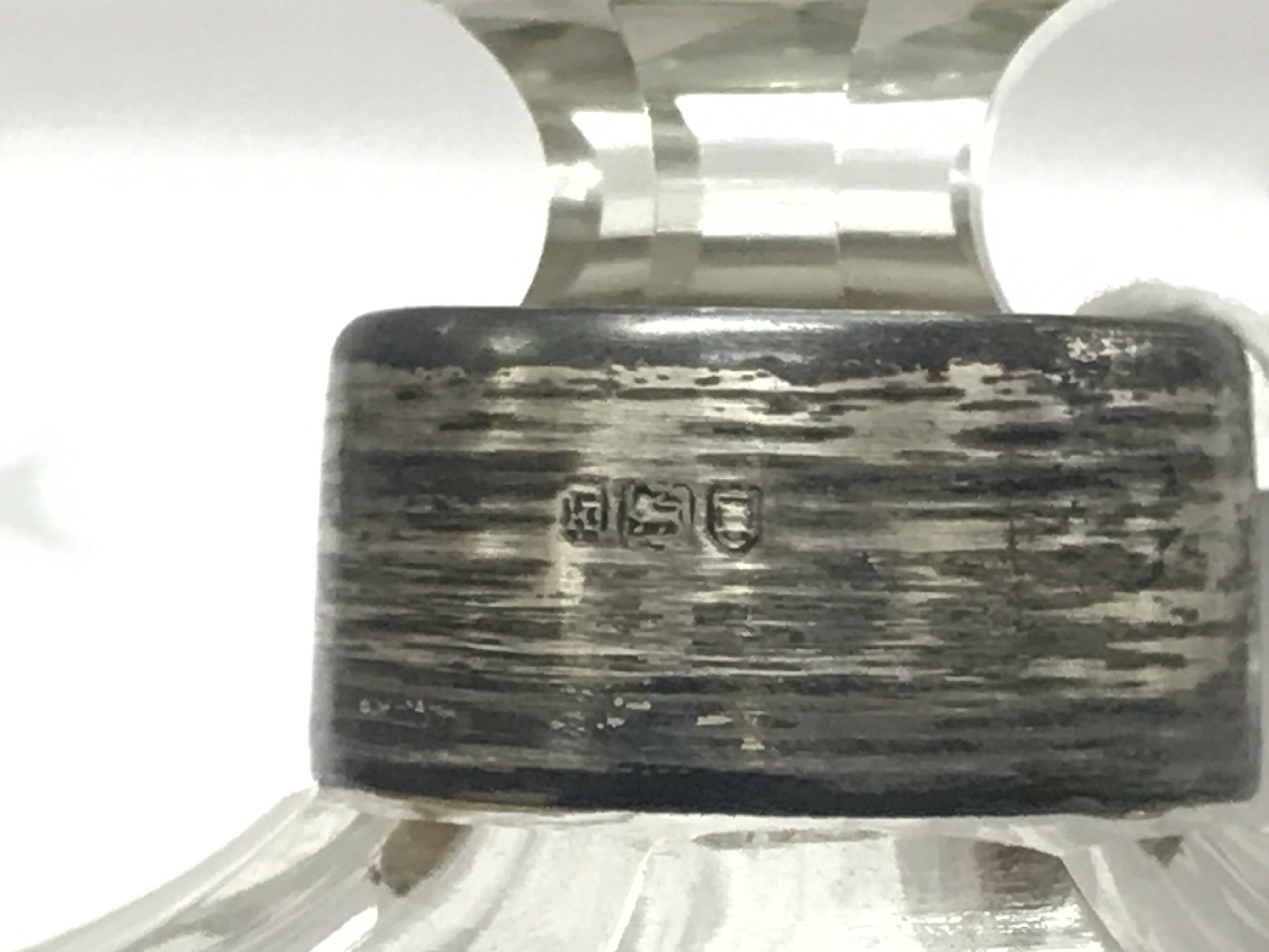 A silver Hallmarked topped cut crystal glass bottle , this lot cannot be posted- NO RESERVE