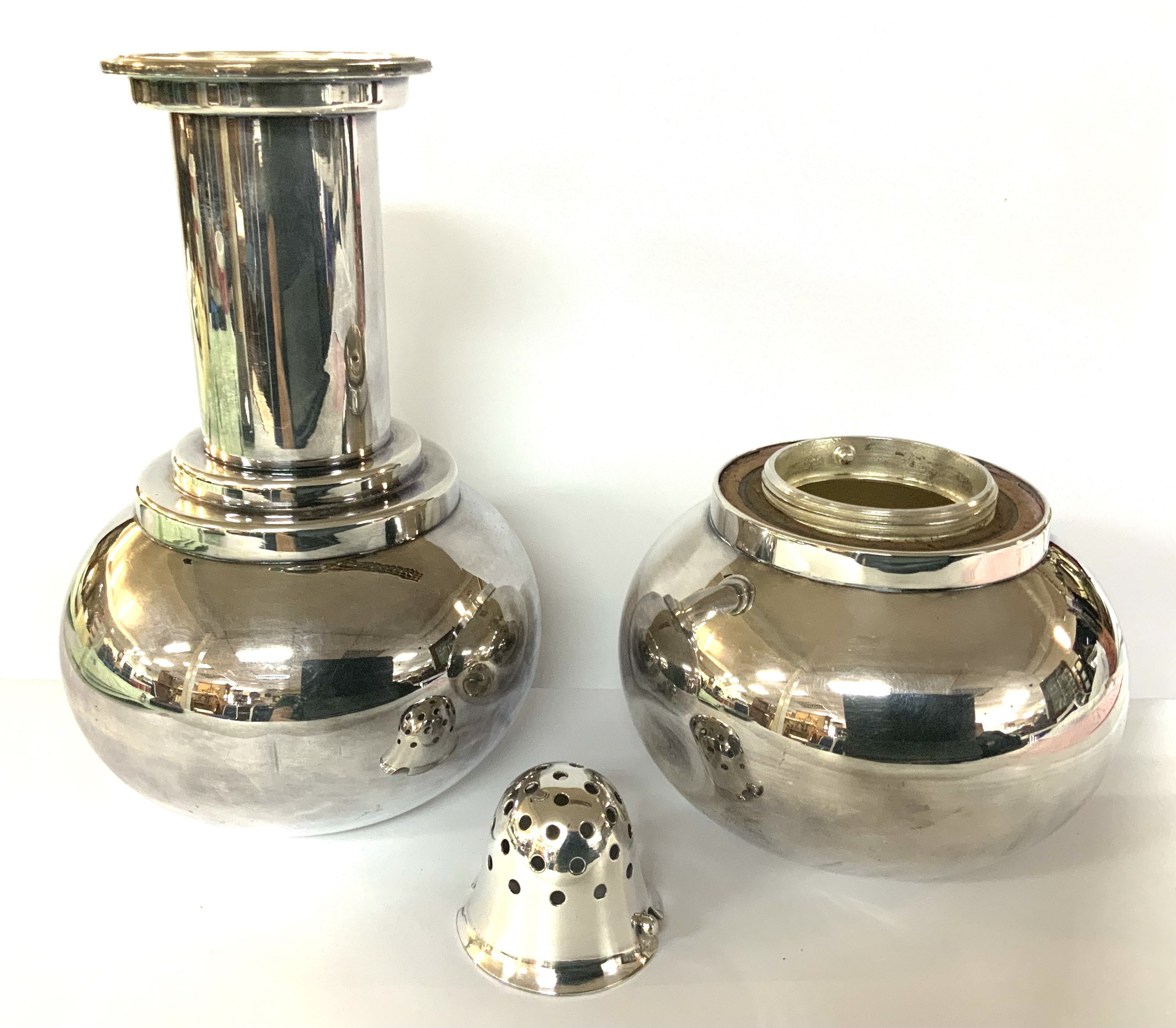 A Silver plated DUMBBELL COCKTAIL SHAKER Asprey, circa 1930 Modelled as a dumbbell, one end with a removable strainer, height 26cm.