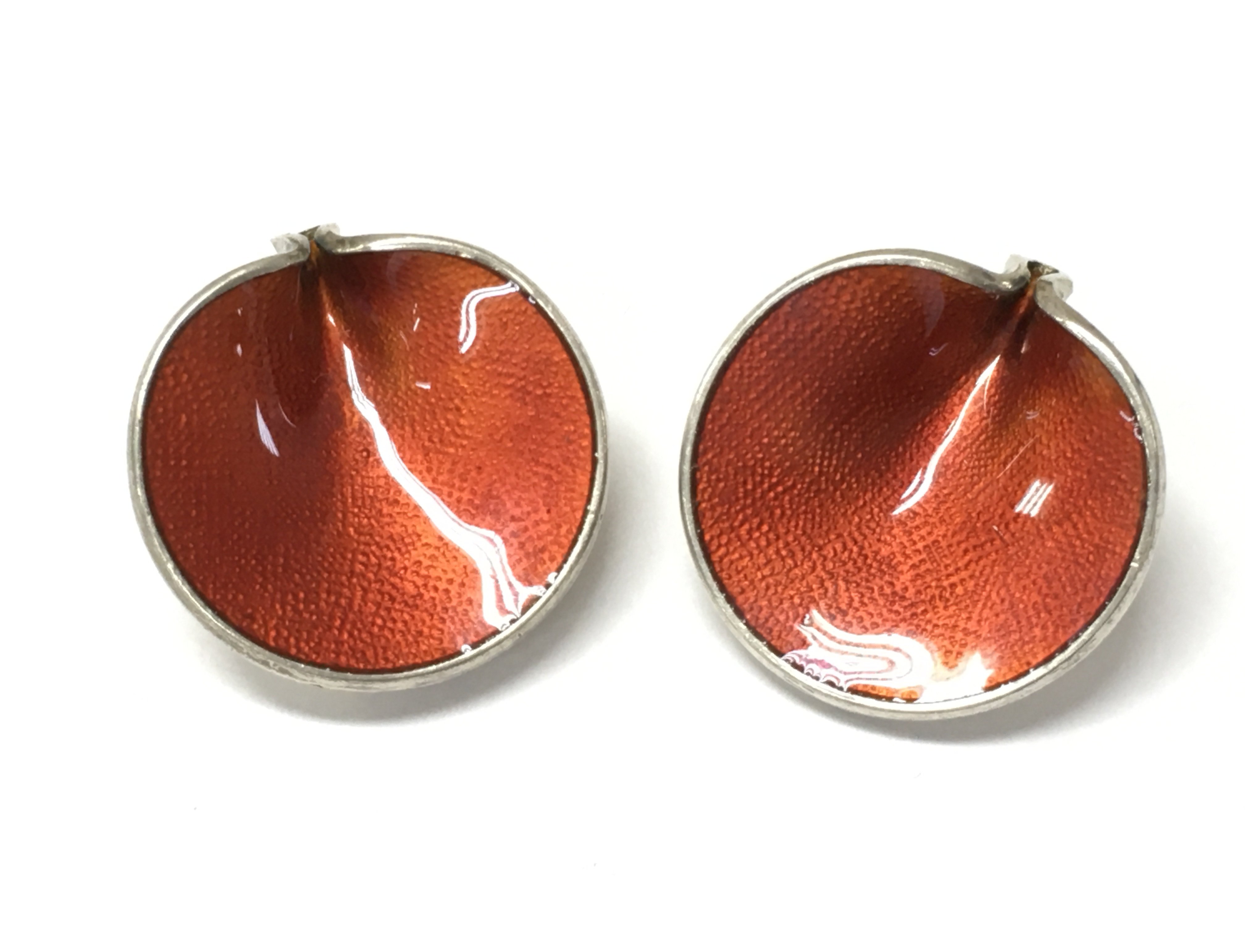 A pair of red silver earrings . Postage category A